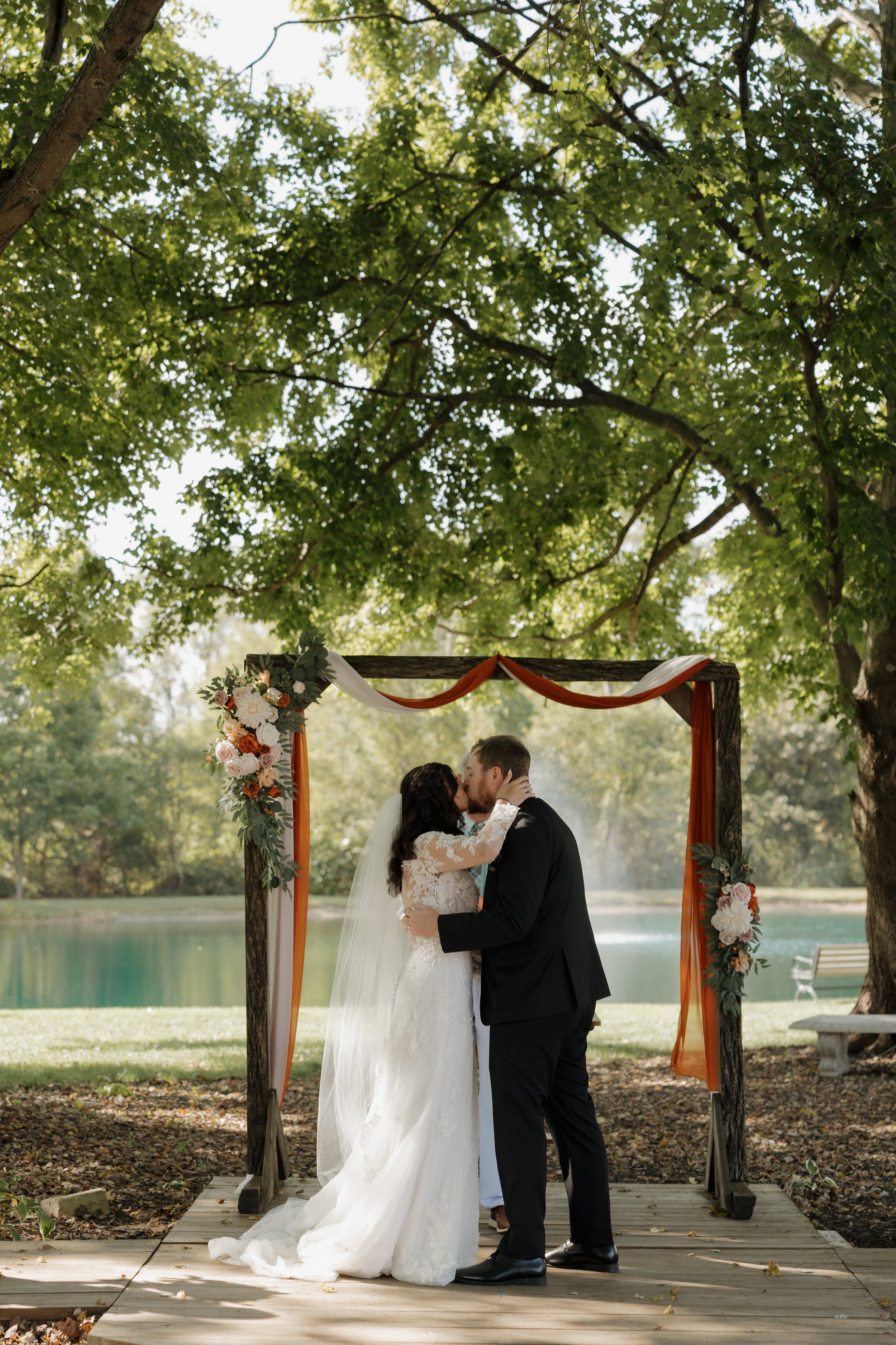 bride and groom first kiss