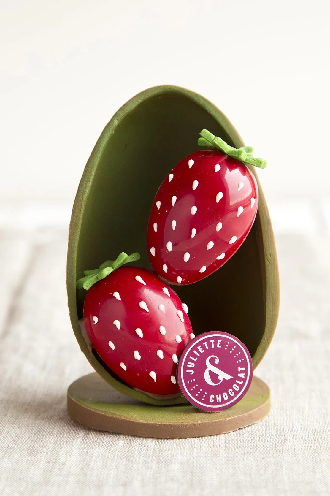 Easter chocolate egg decorated to look like strawberries
