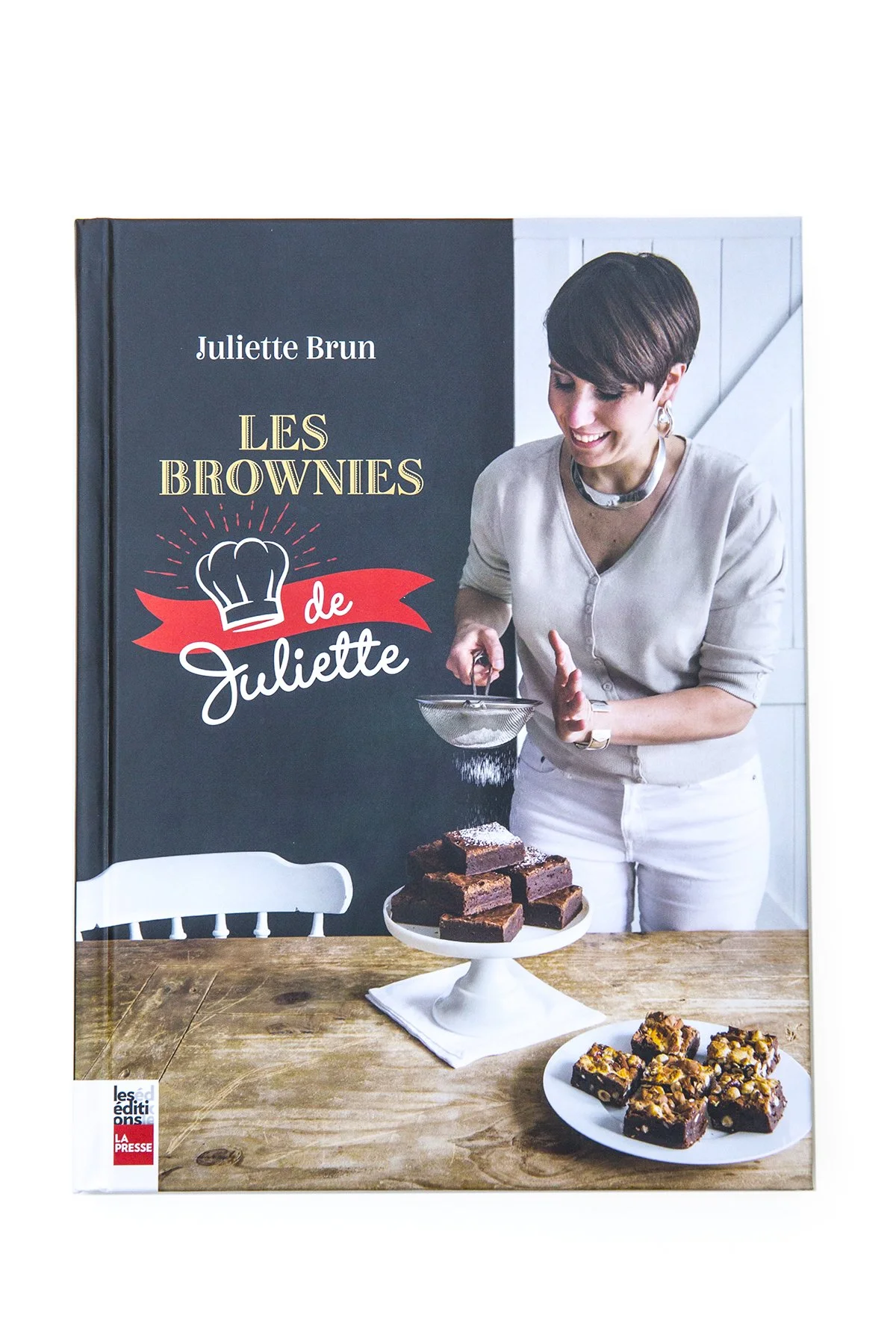 Cookbook cover: Juliette's Brownies, showing Juliette plating brownies