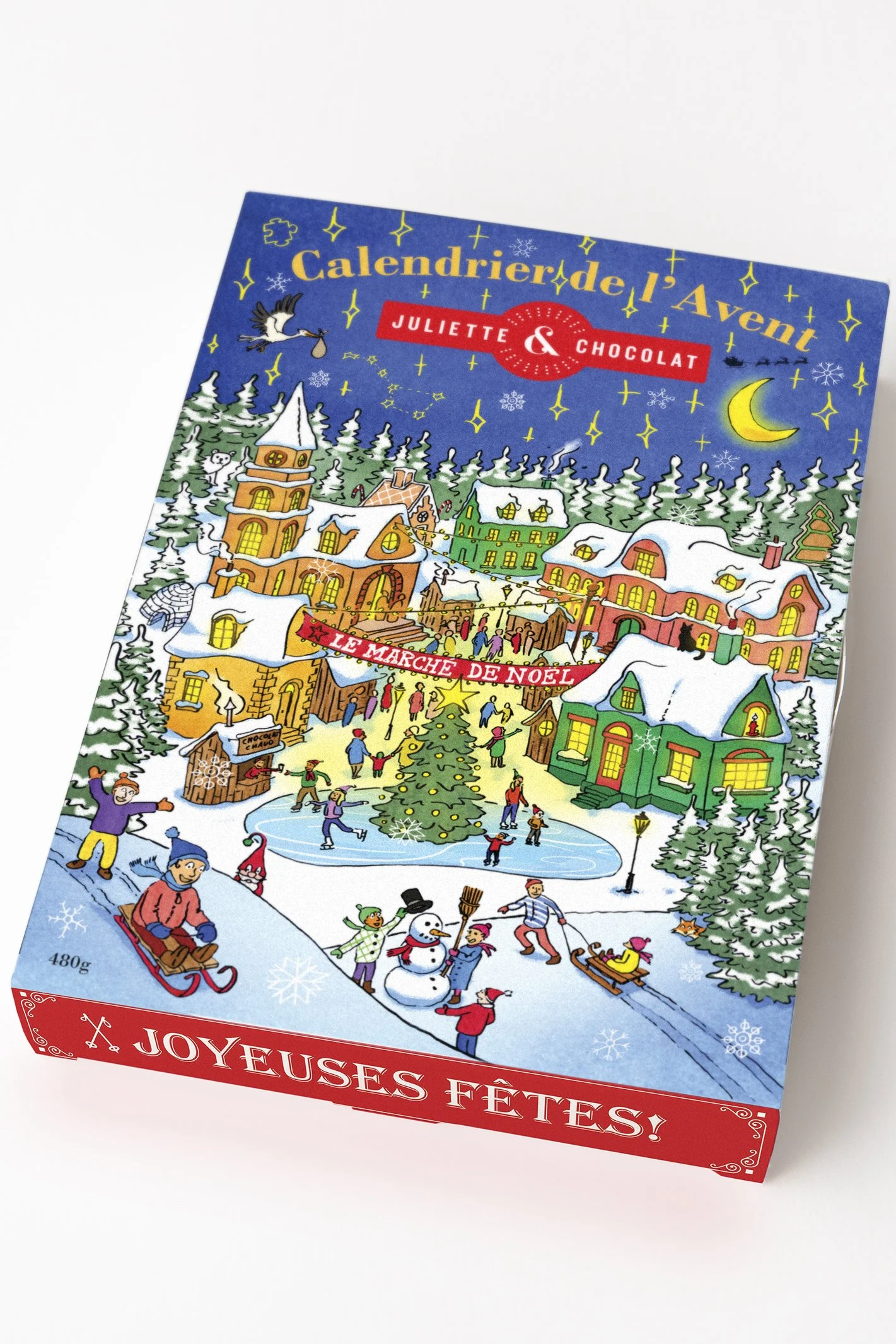 Chocolate Advent Calendar for the brand Juliette & Chocolat in a box ecorated with a colorful Christmas town