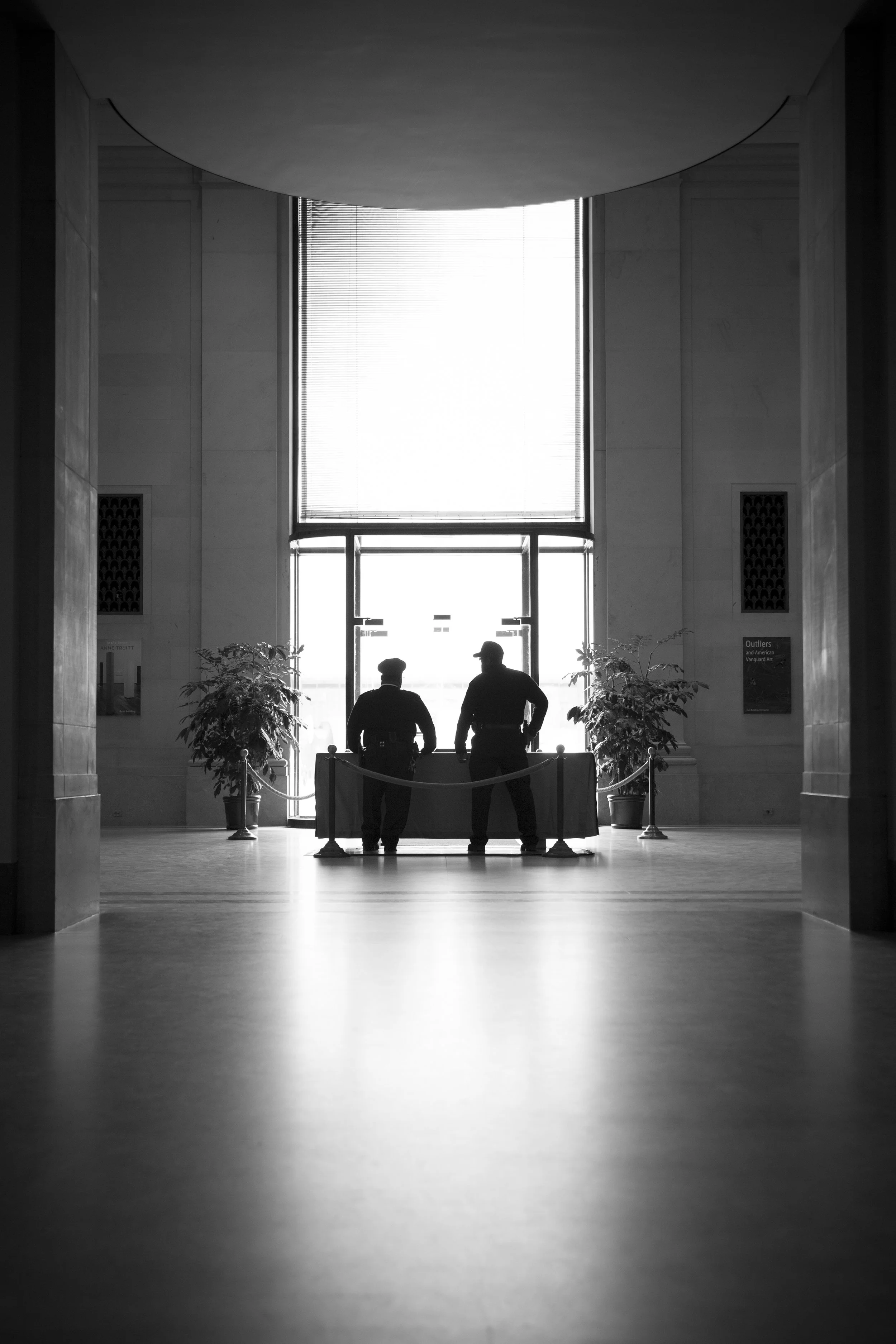 Entrance to the art museum in Washington in the United States, beautiful lighting with sihouettes captured in black and white, architectural photography