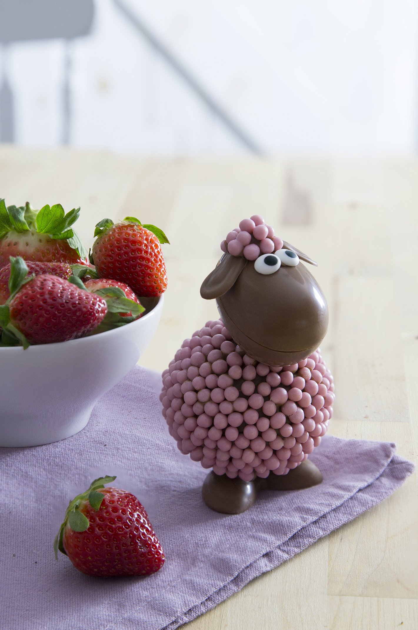 A chocolate sheep, made with milk chocolate and strawberry crispy pearls