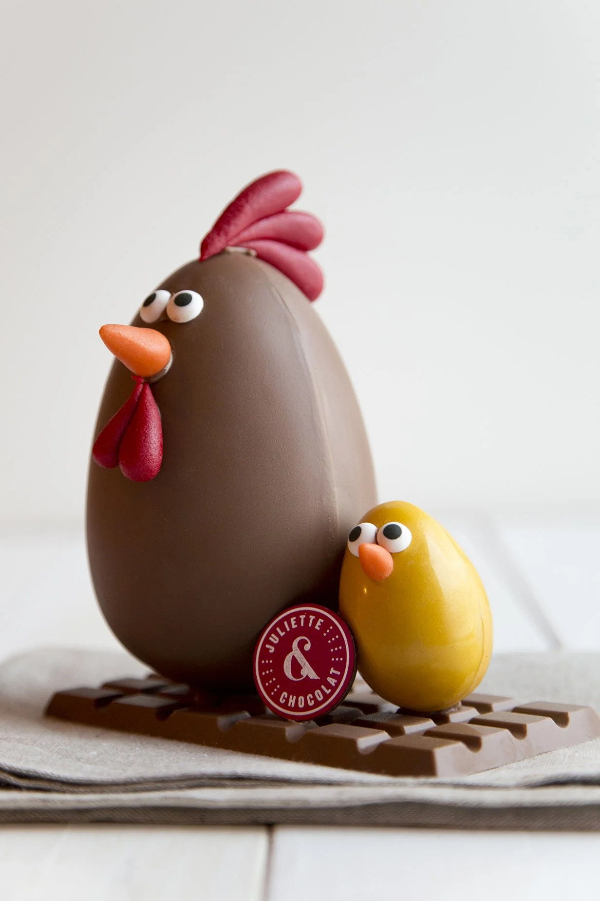 Chocolate Easter eggs in the shape of a rooster and a yellow chick