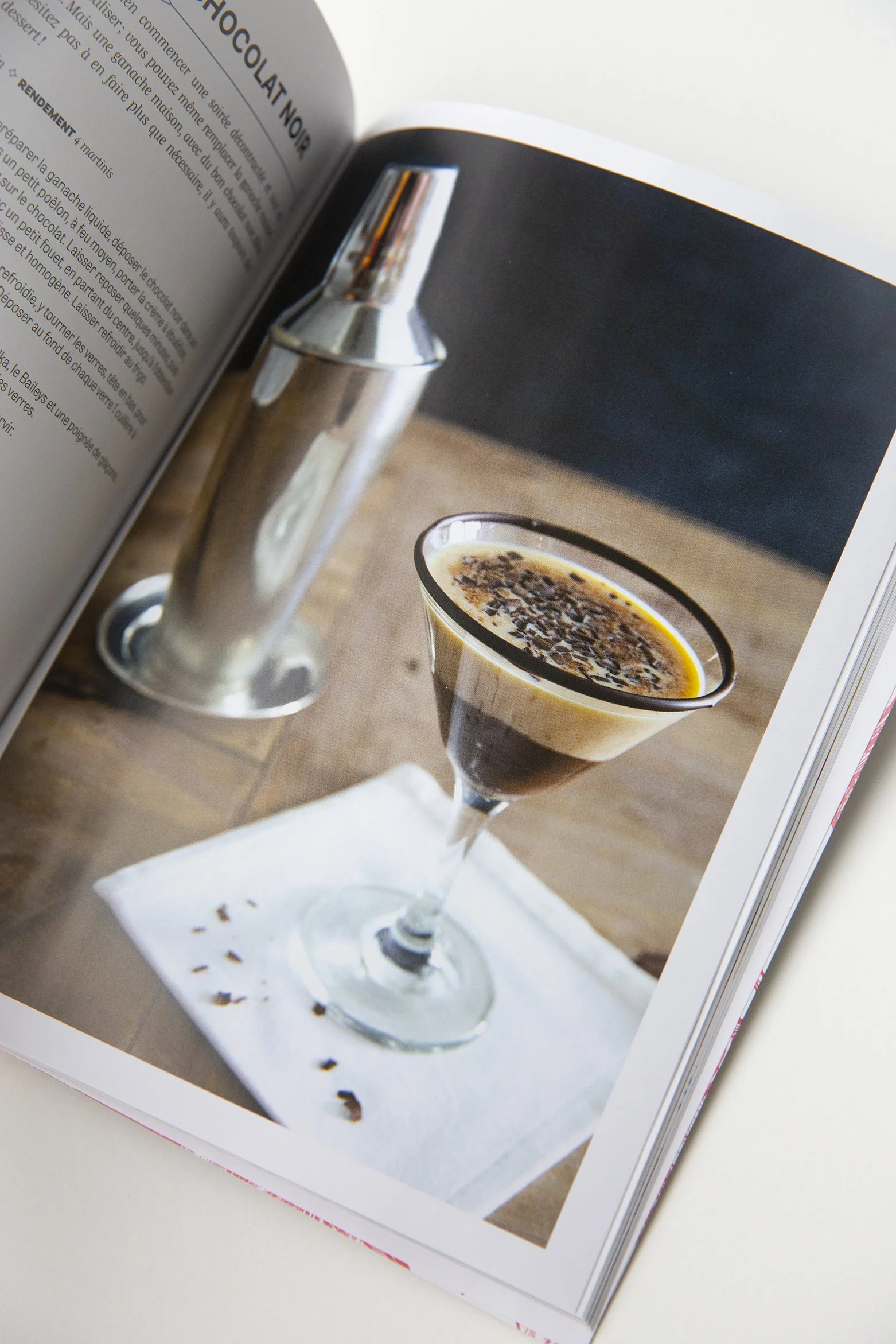 Chocolate recipe book opened and showing a photo and recipe for a chocolate martini