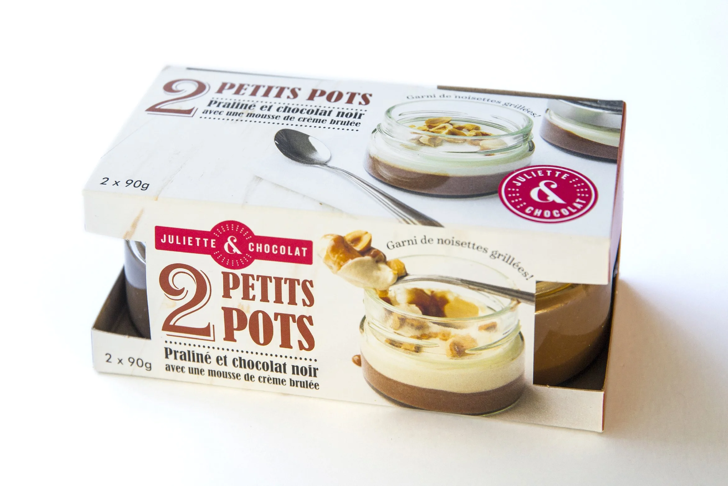 Hazelnut mousse jars in retail packaging with photo