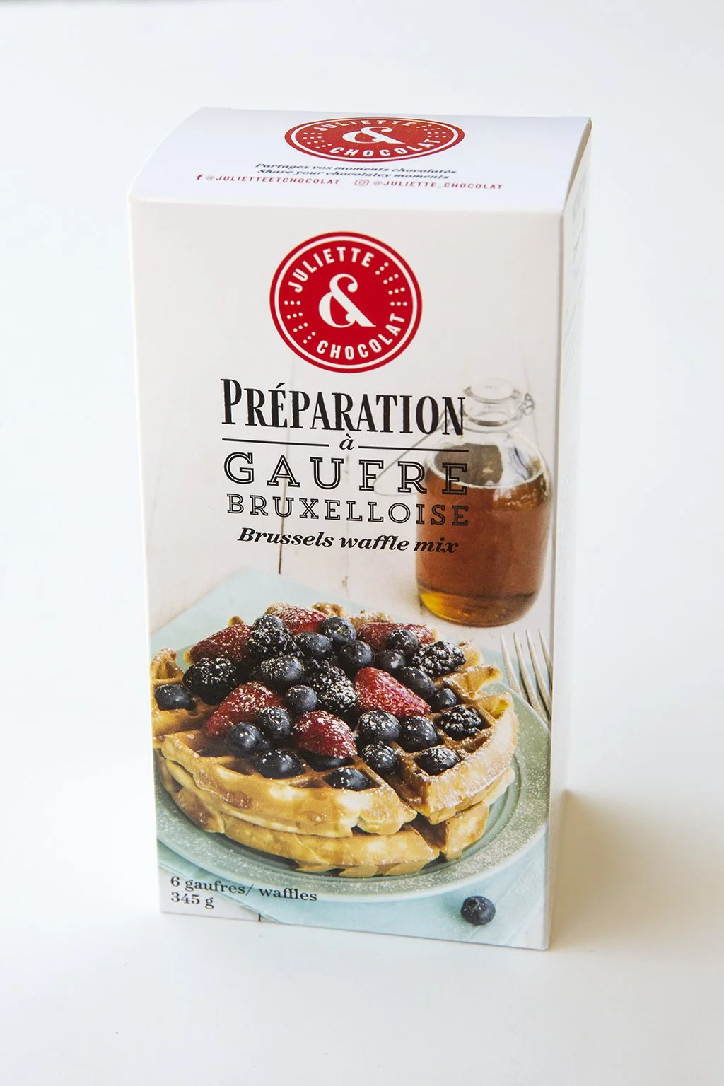 Artisanal cooking mix to make Belgian Waffles, tall box with photo of waffles, fruits and maple syrup.