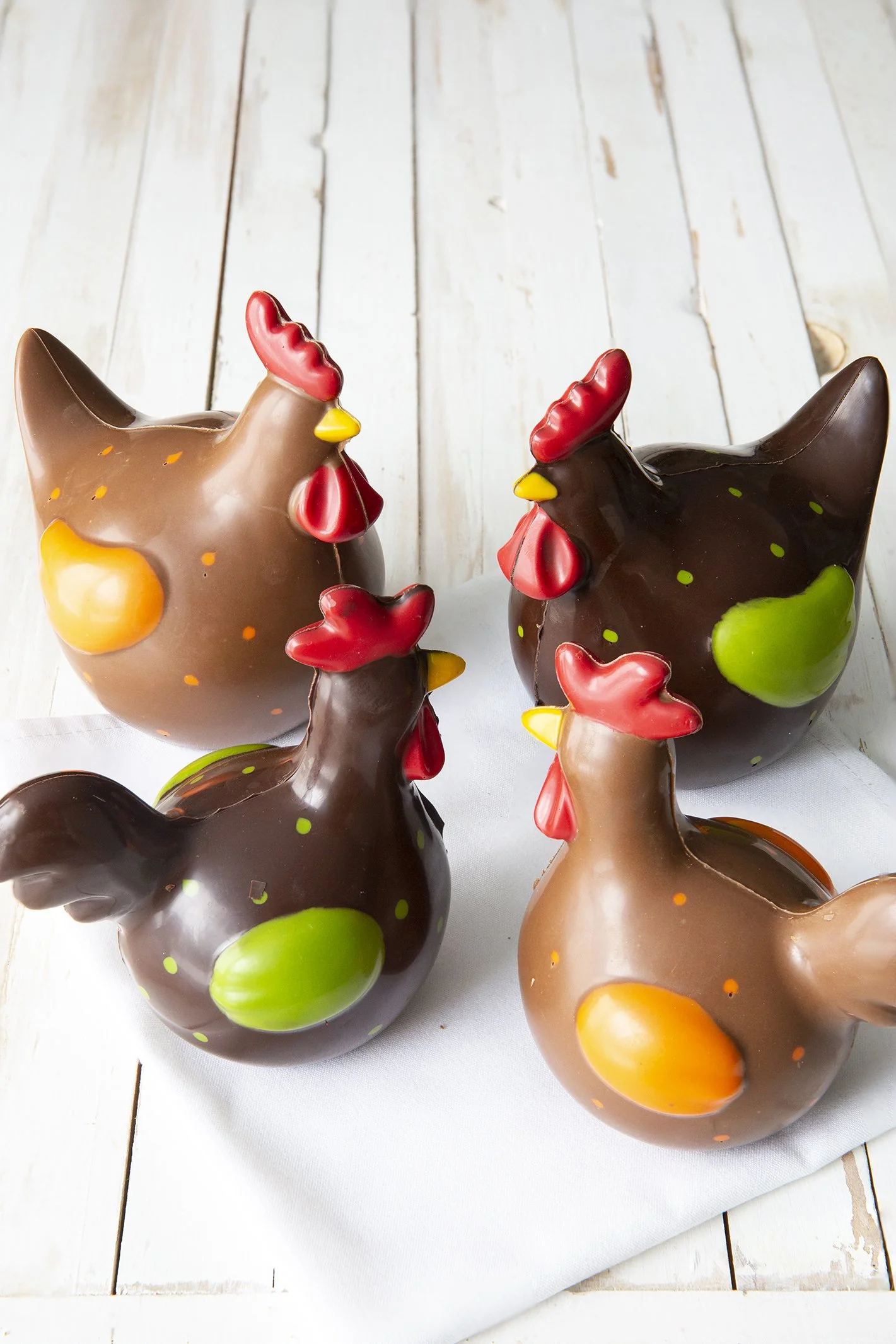 Colorful Easter chocolate hens in milk and dark belgian chocolate