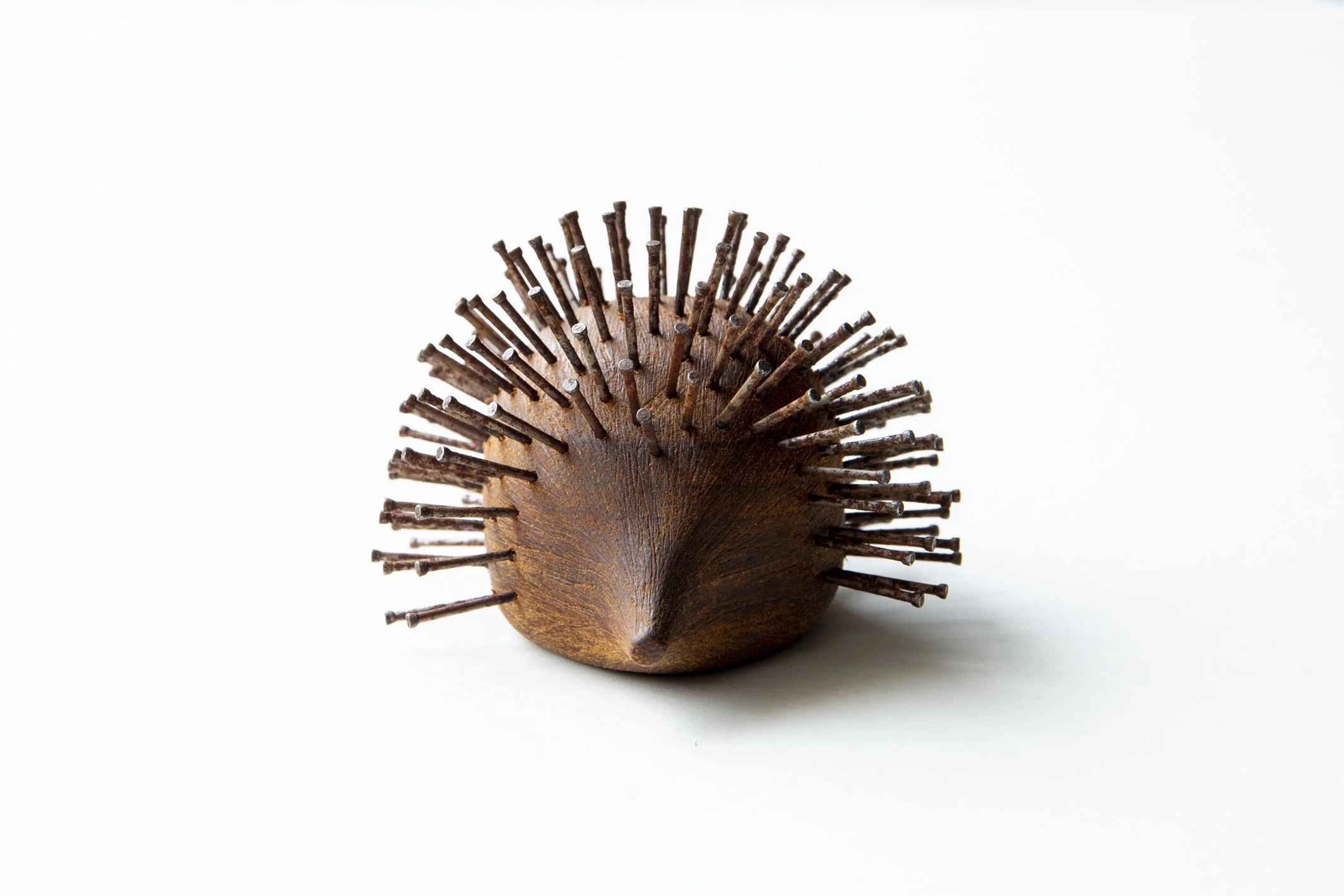 Small wooden hedgehog sculpture by Lionel May