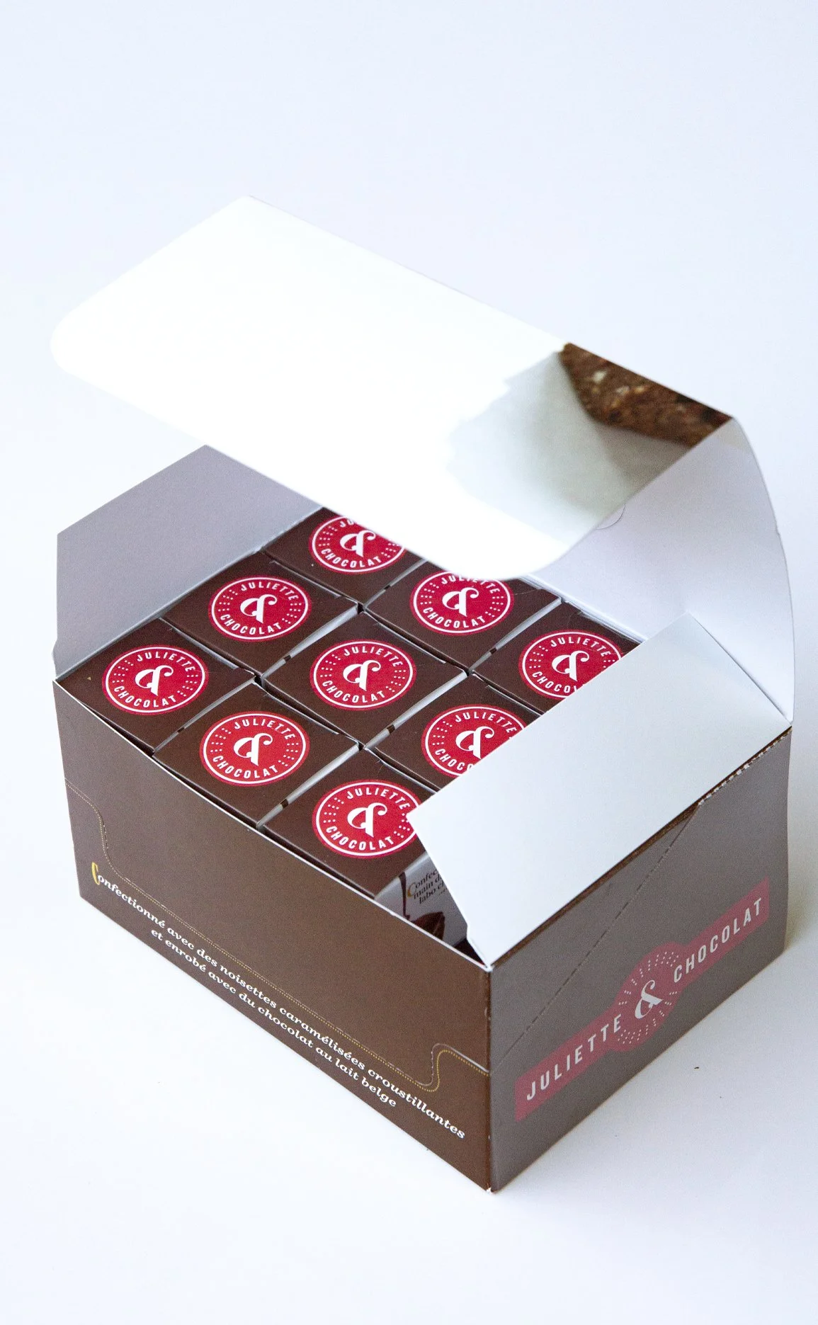 Open retail packaging for chocolate confections, with smaller boxes of chocolate confections