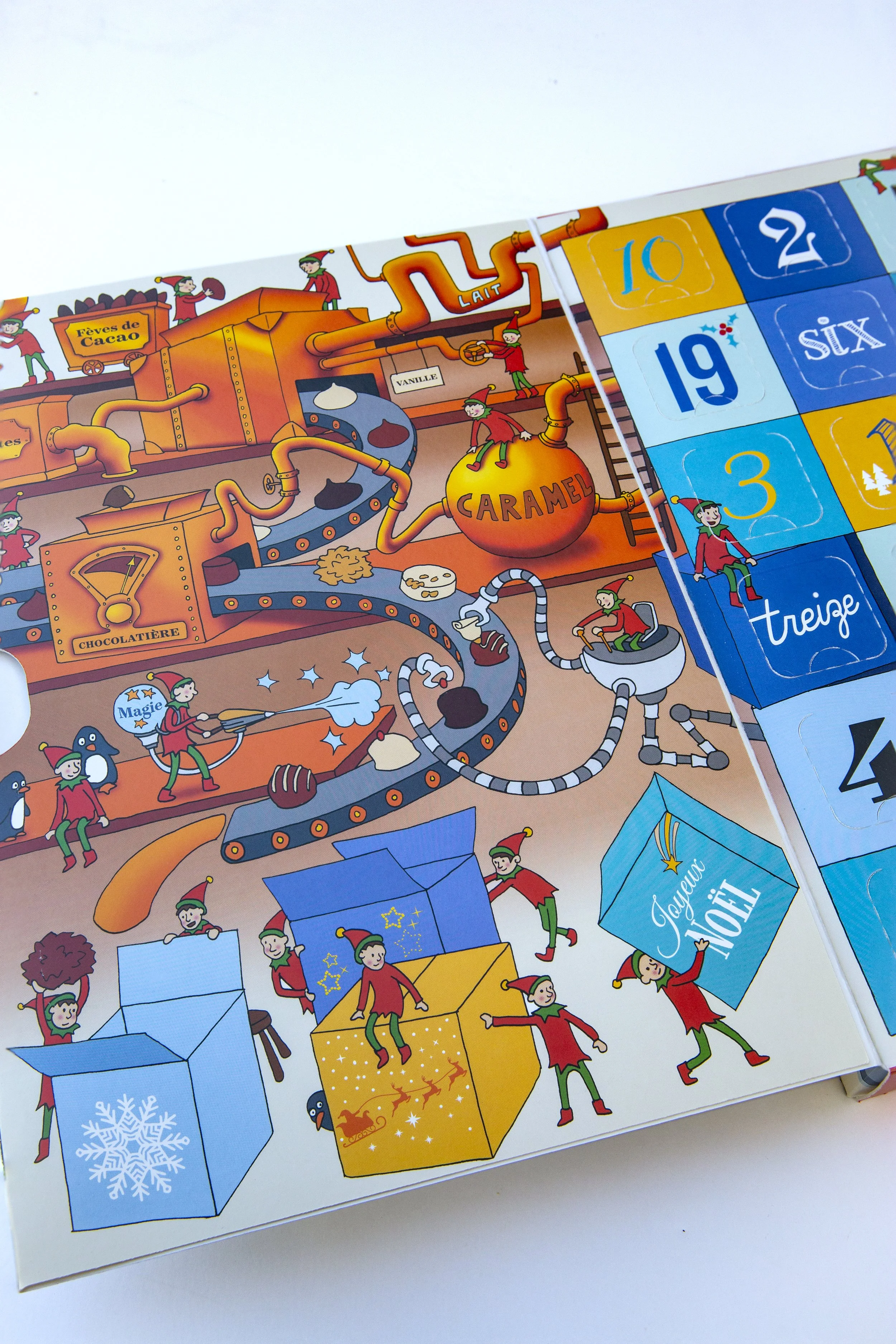 Advent Calendar box showing Santa's workshop, with elves making Christmas chocolates