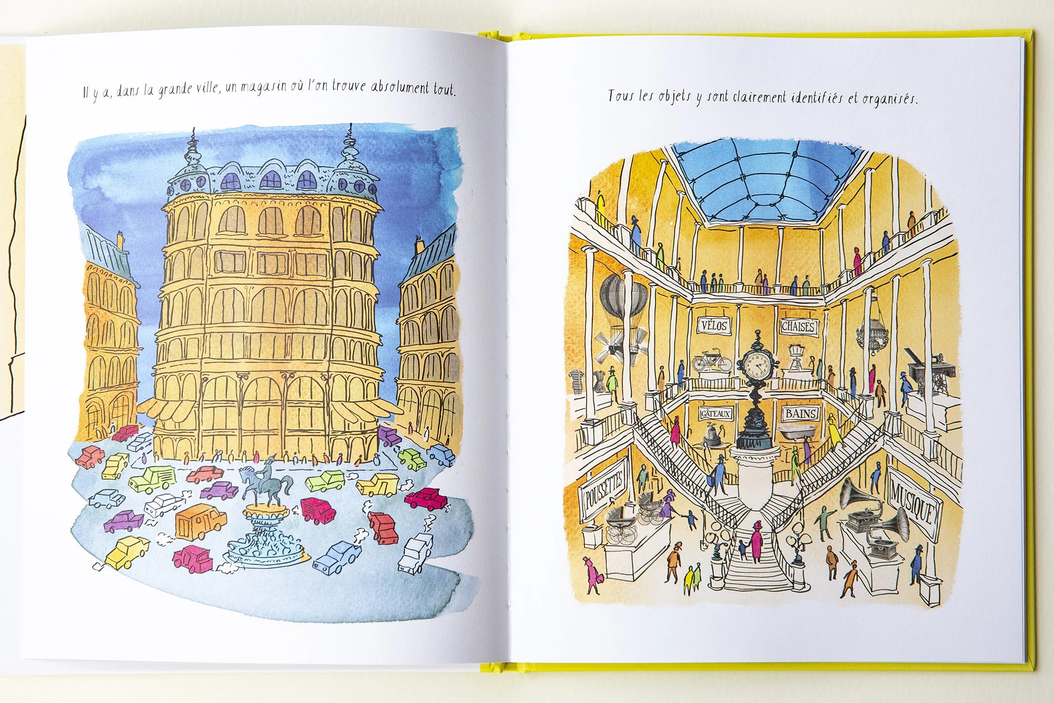 Open illustrated book showing colorful images of a large store full of quirky objects