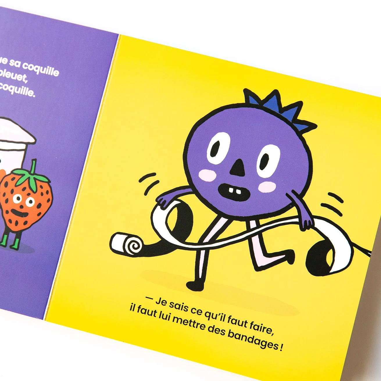 A page from a colorful picture book showing a funny blueberry on a yellow background