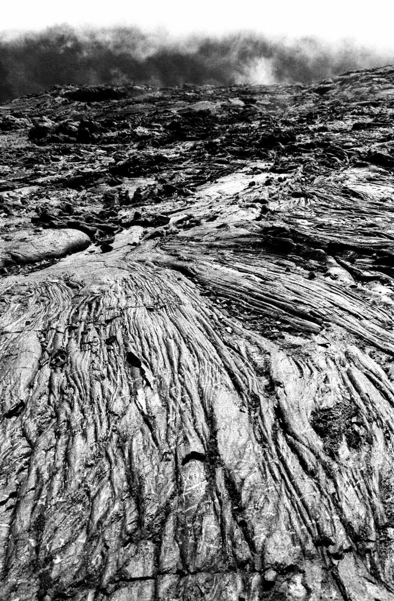 Cold lava flows at the summit of le Piton de la Fournaise, the volcano at the center of la Reunion, the French island. Black and white fine art photograhy 