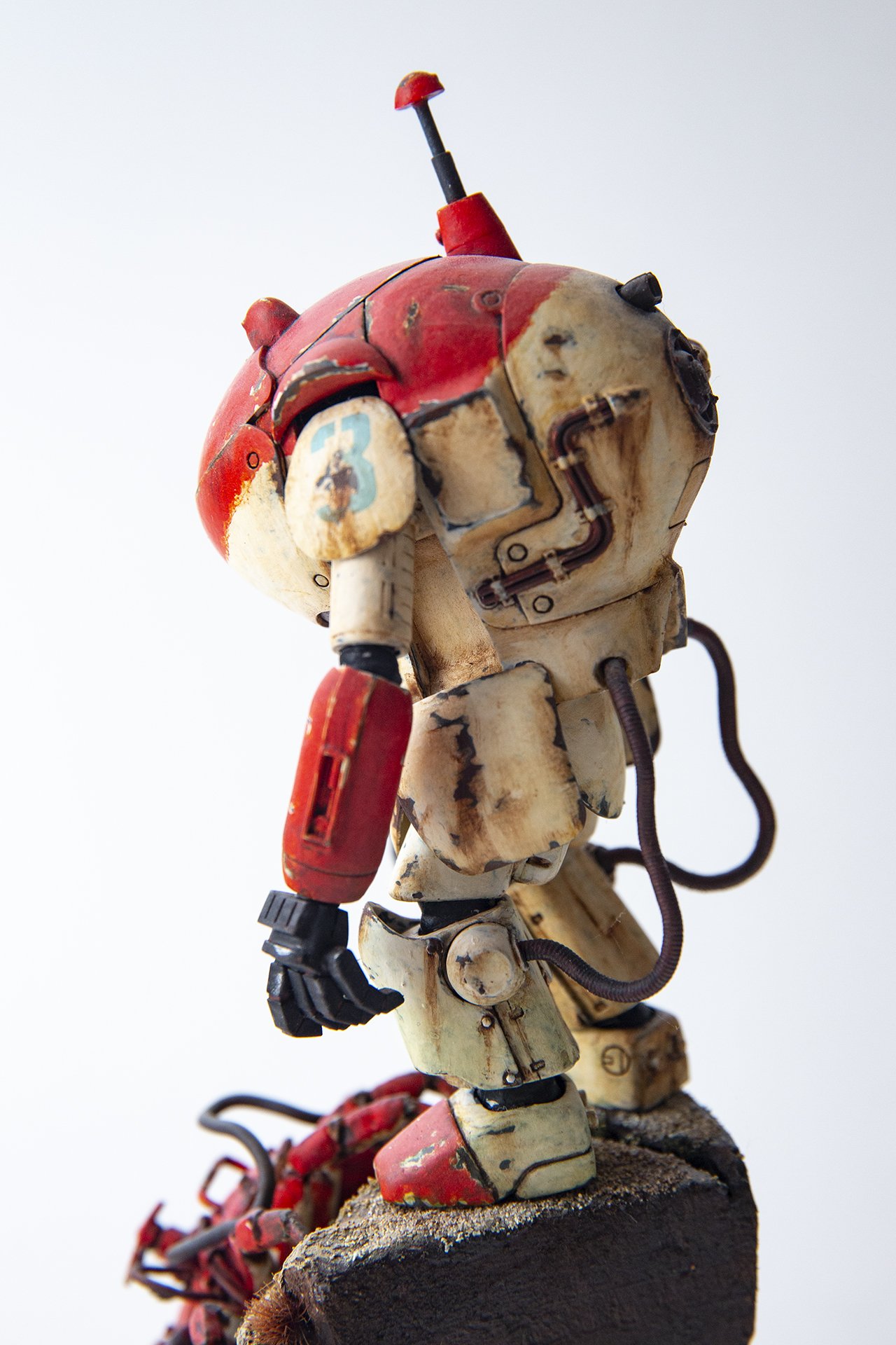 A miniature scale model of a robotic power suit, sci-fi scene on diorama base. 
