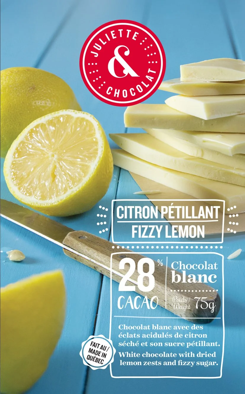 White chocolate and lemon on blue wooden background on chocolate bar packaging