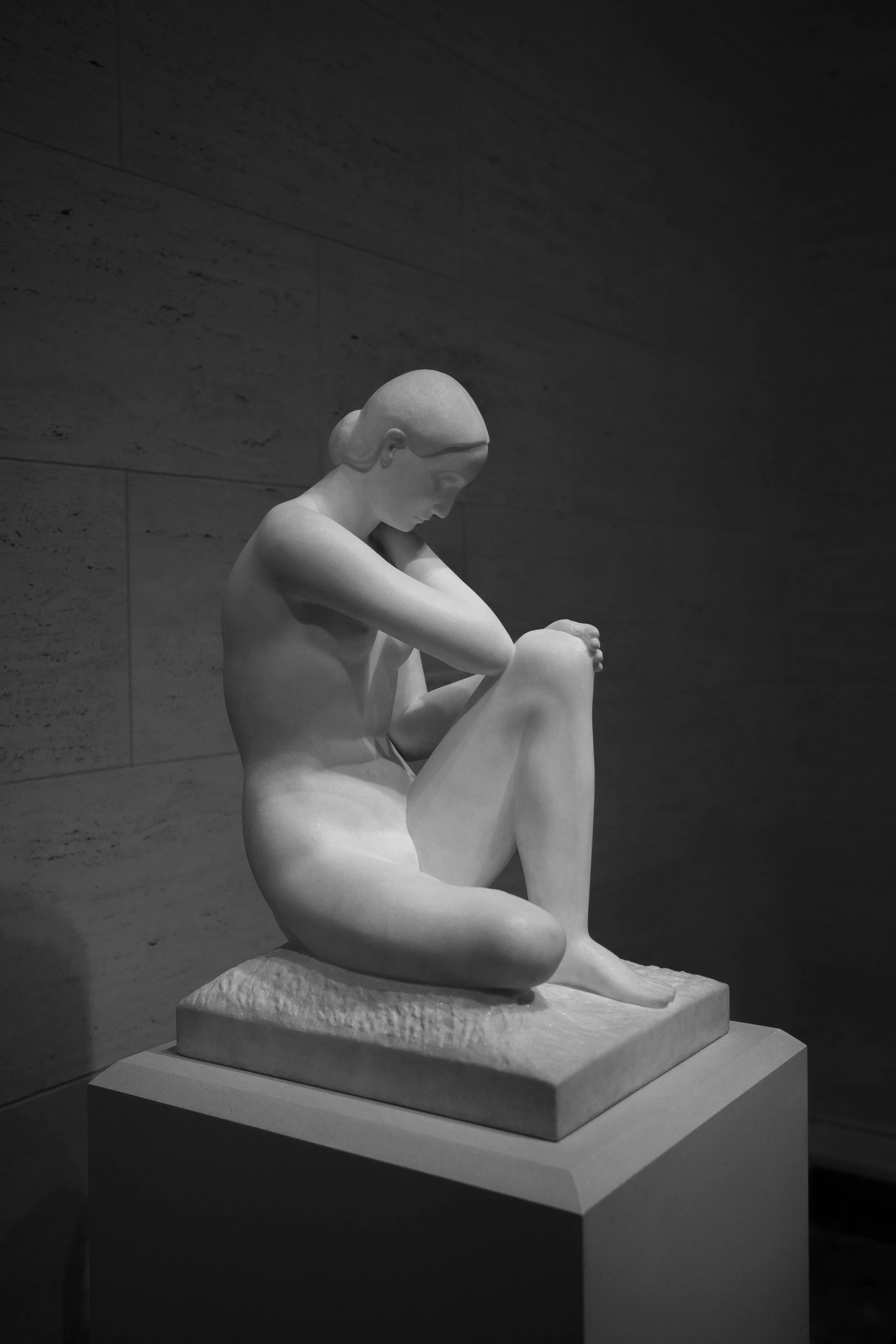 Statue of pensive woman carved in stone, photo taken in Washington DC's Natural History Museum, cpatured by Lionel May