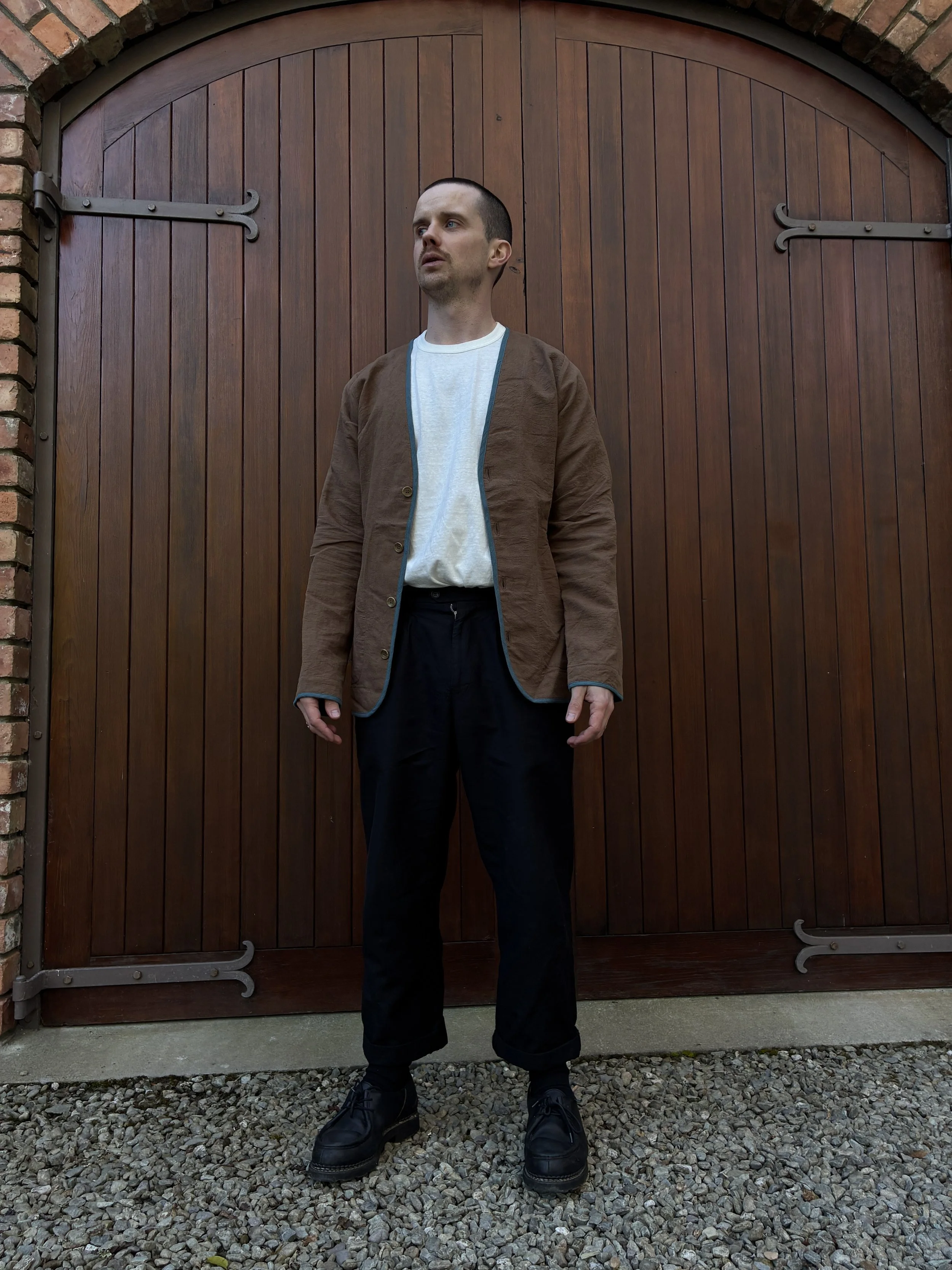 Man wearing Frank Leder Linen Cotton Brown Teal Jacket outside in front of door