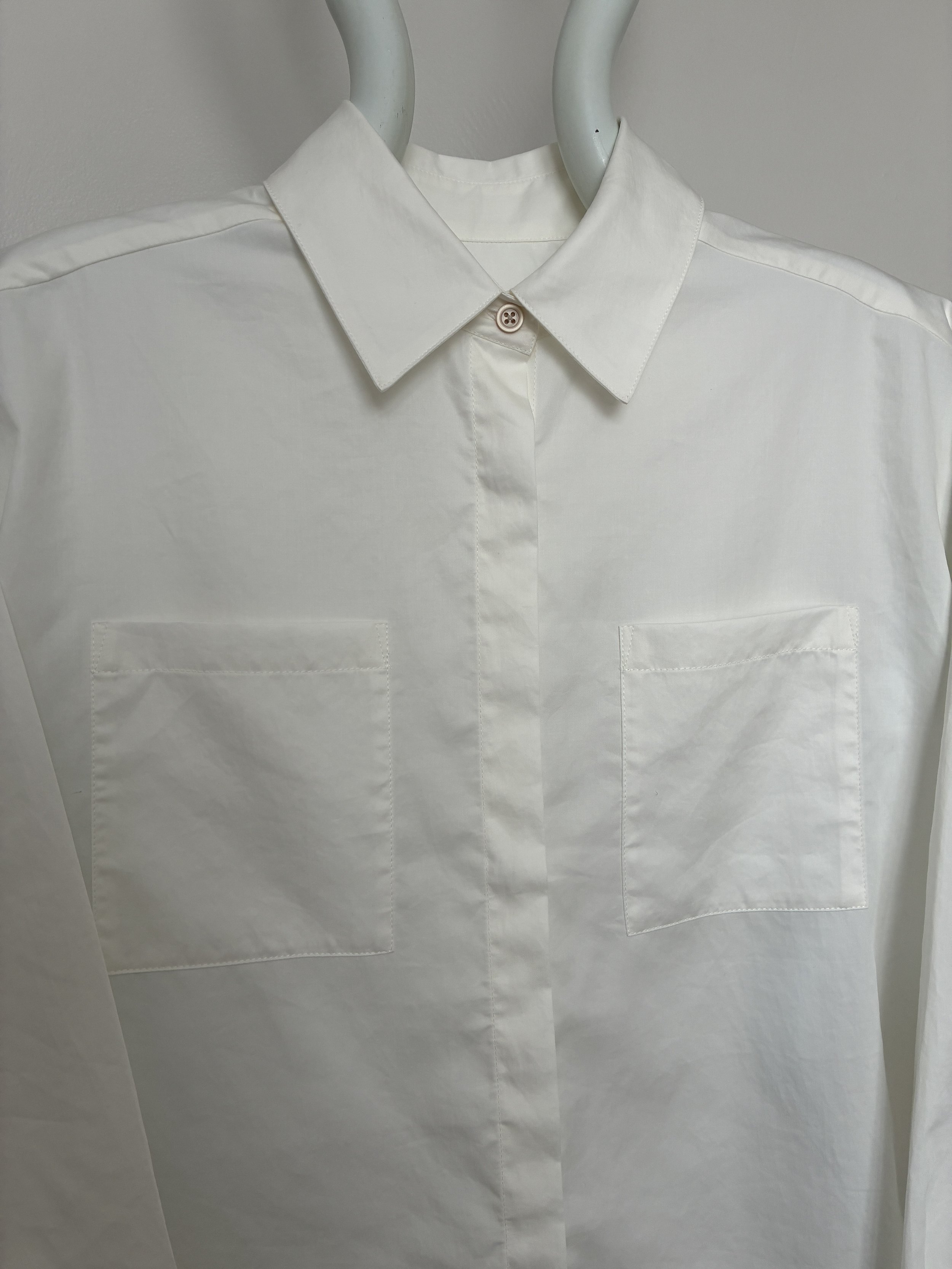 Closeup of front of White 1st PAT-RN Woman Modula Shirt on mannequin