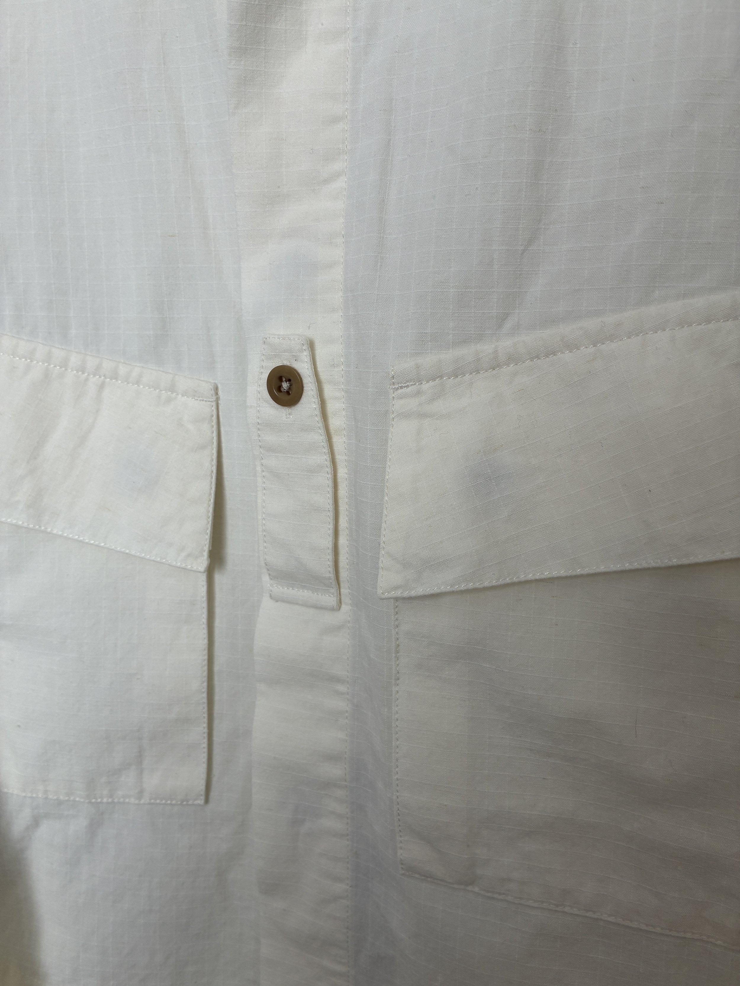 Closeup of button of Off-White Ecru 1st PAT-RN Sumatra Overshirt