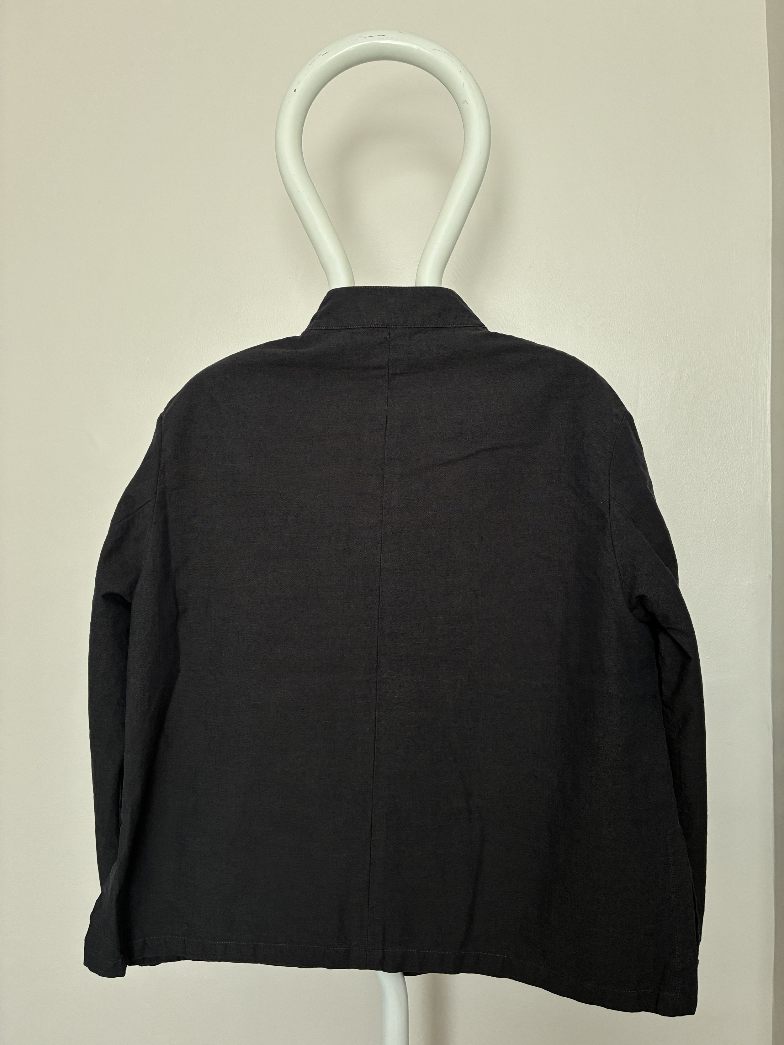 Back of Navy 1st PAT-RN Woman Rei Jacket on mannequin
