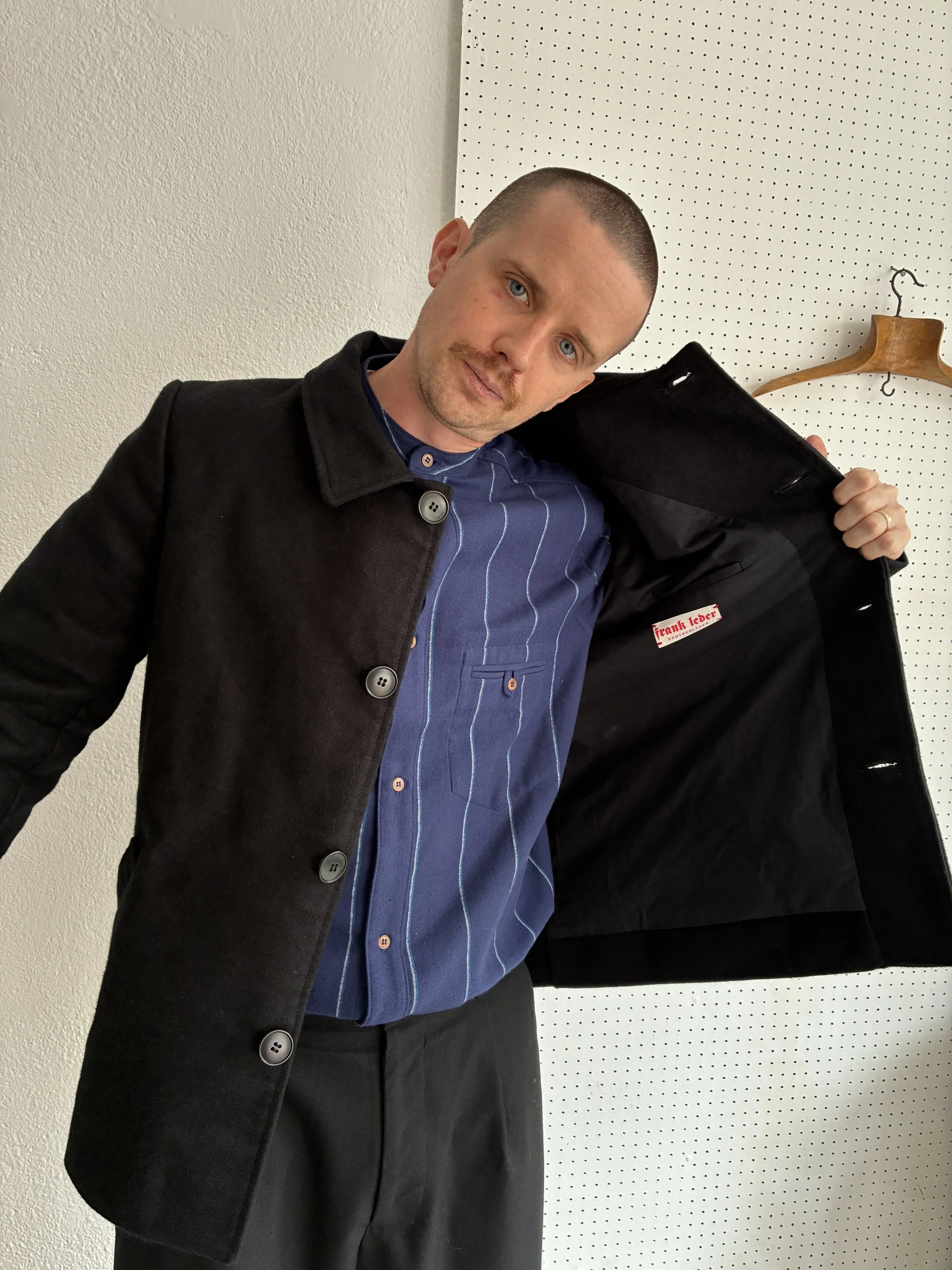 Model opens up inside of Black Frank Leder Deutschleder Jacket