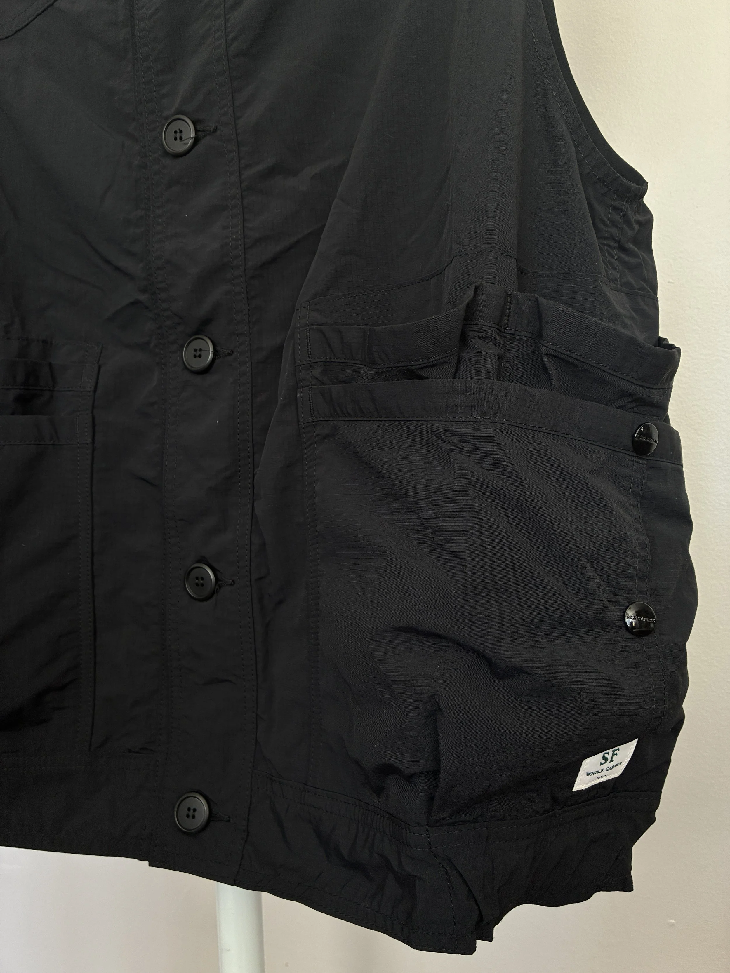 Closeup of pockets of Black Sassafras Overgrown Hiker Vest