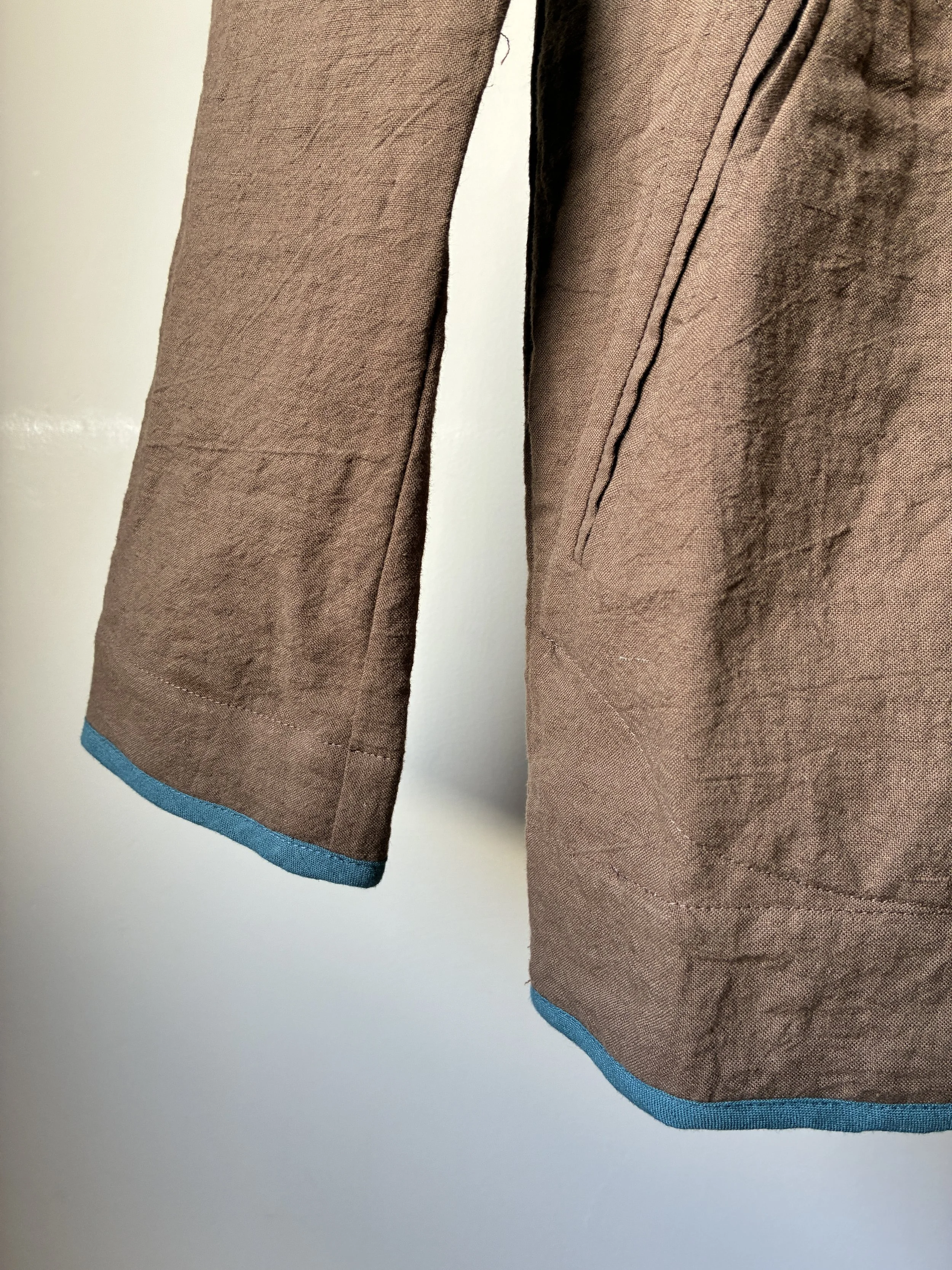 Closeup of Sleeve of Frank Leder Linen Cotton Brown Teal Jacket on mannequin