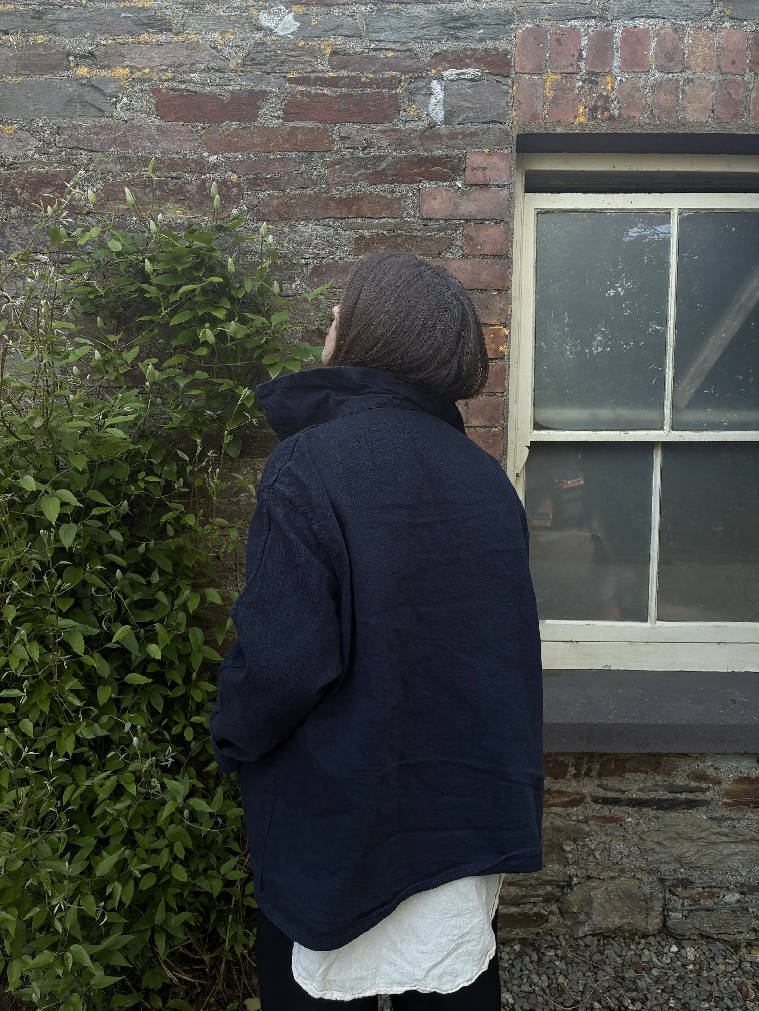 Back of woman wearing Tender Co 931 Scout Jacket in Hadal Blue