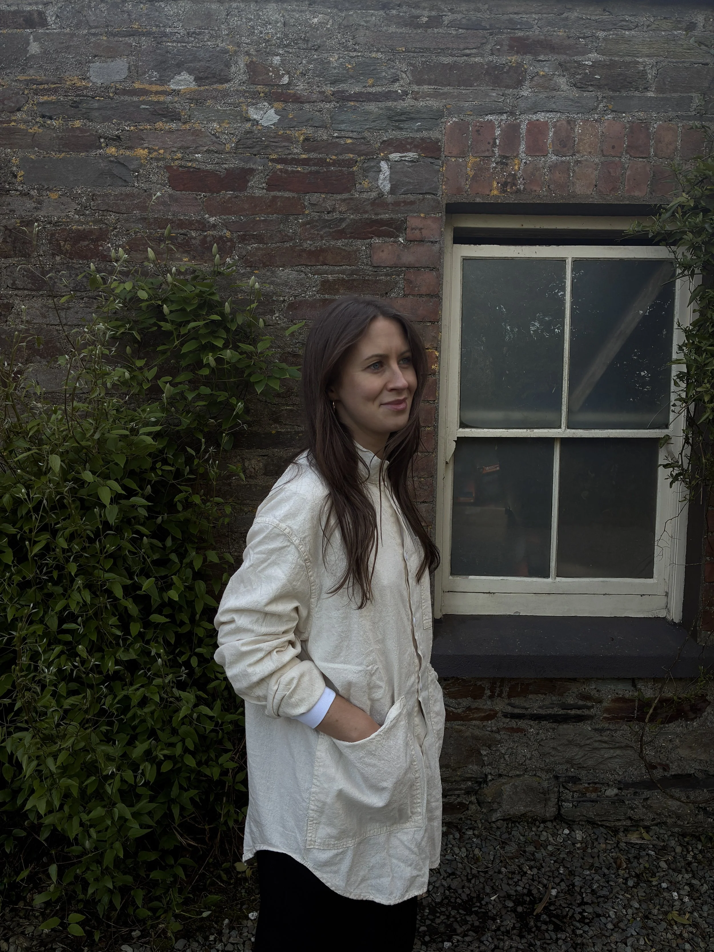 Side view of woman modelling cream Tender Co Type 457 Frock Shirt