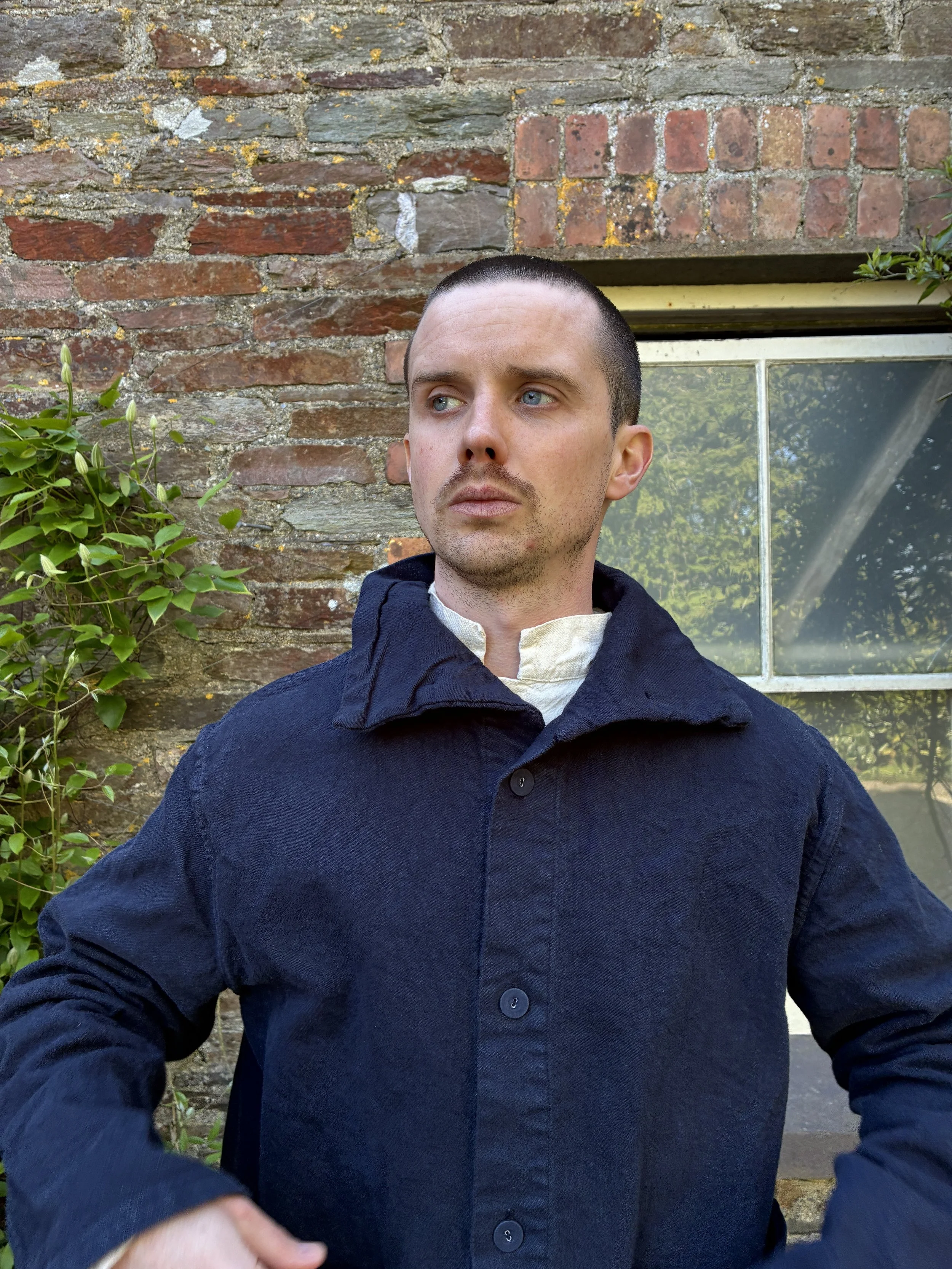 Close up shot of man modelling Tender Co 931 Hadal Blue Scout Jacket