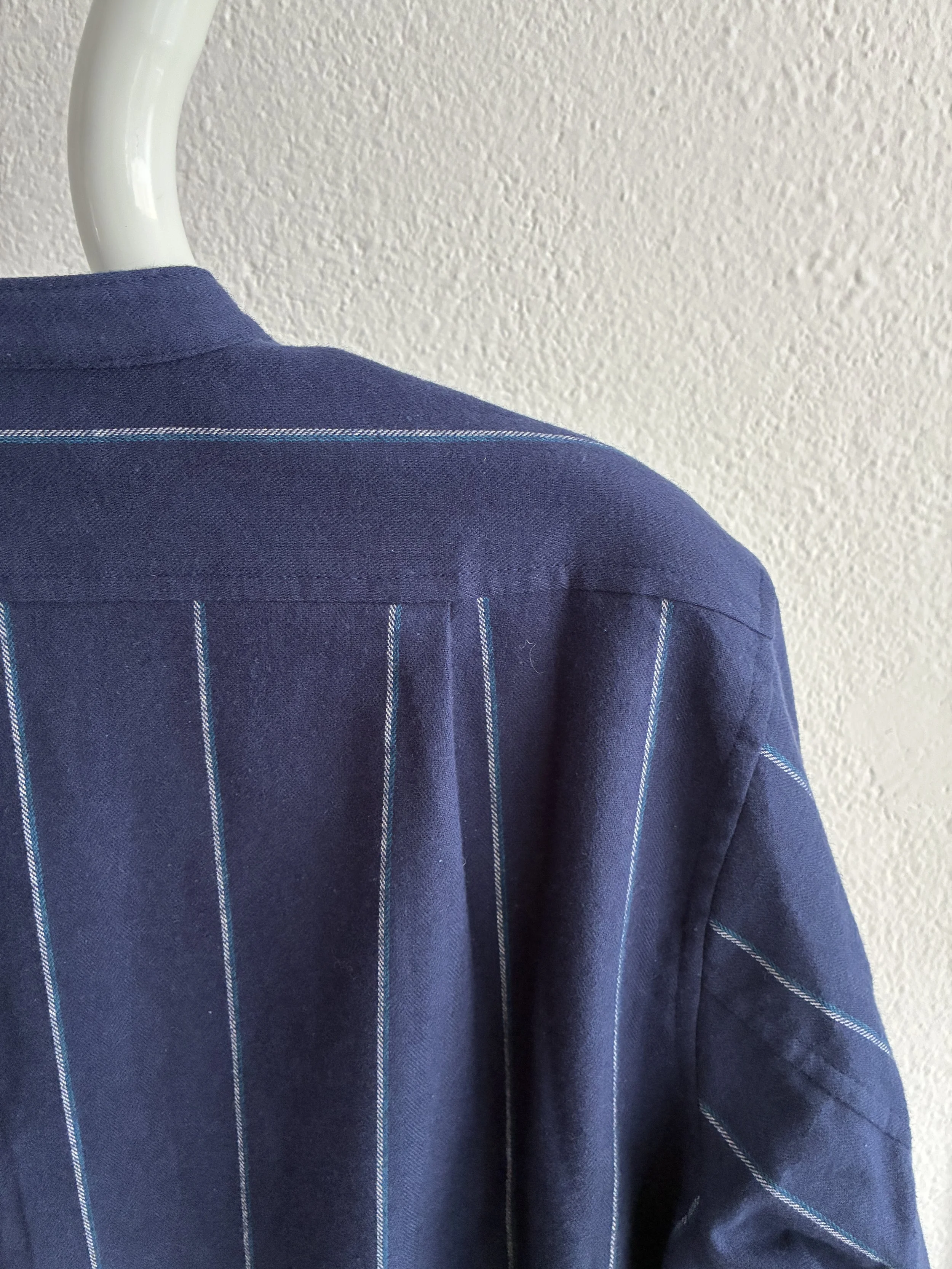Mannequin wears a Frank Leder navy striped shirt, closeup of back