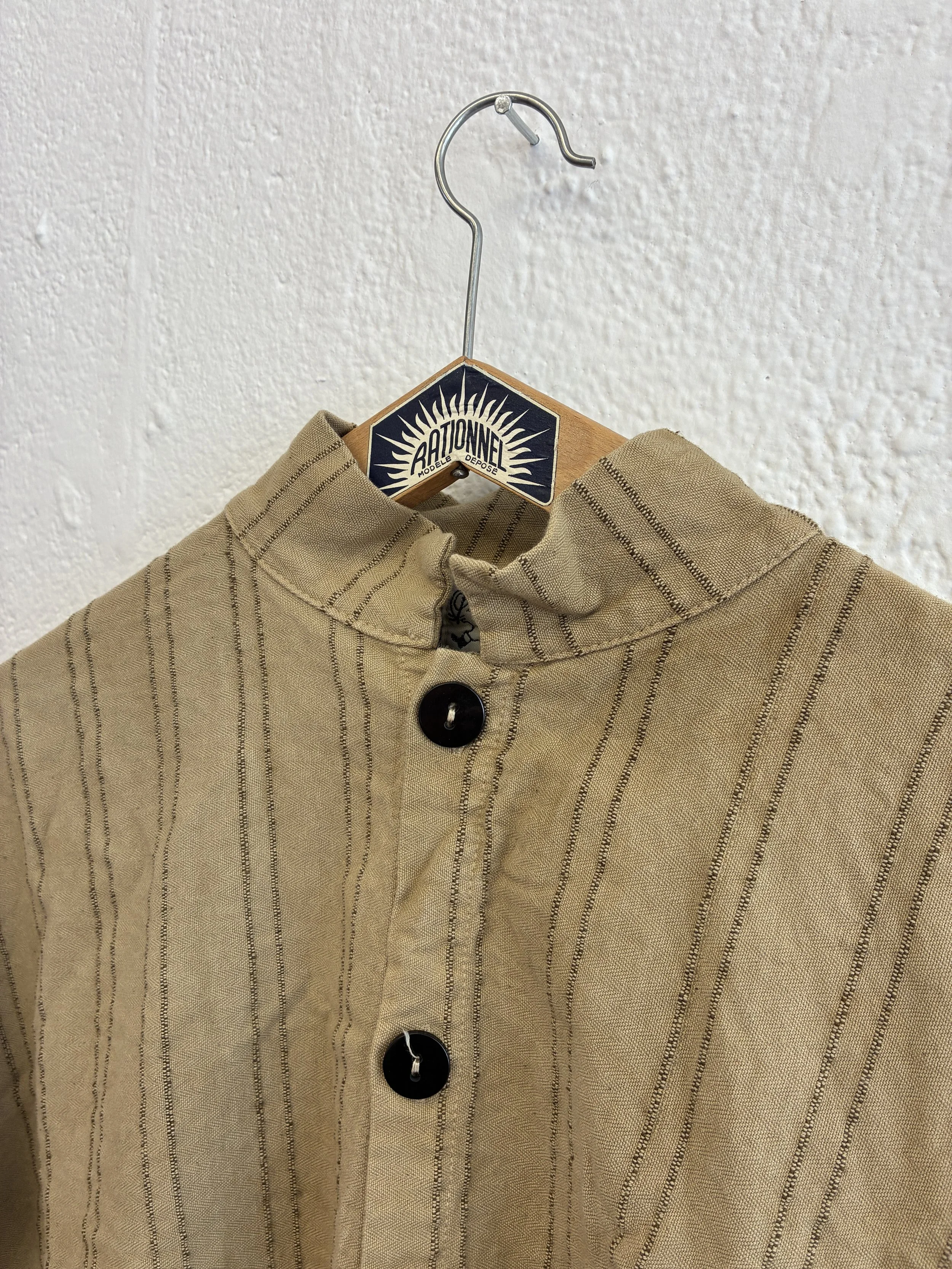 Closeup of Drab Weld Tender Co Type 485 Isosceles Shirt collar on hanger