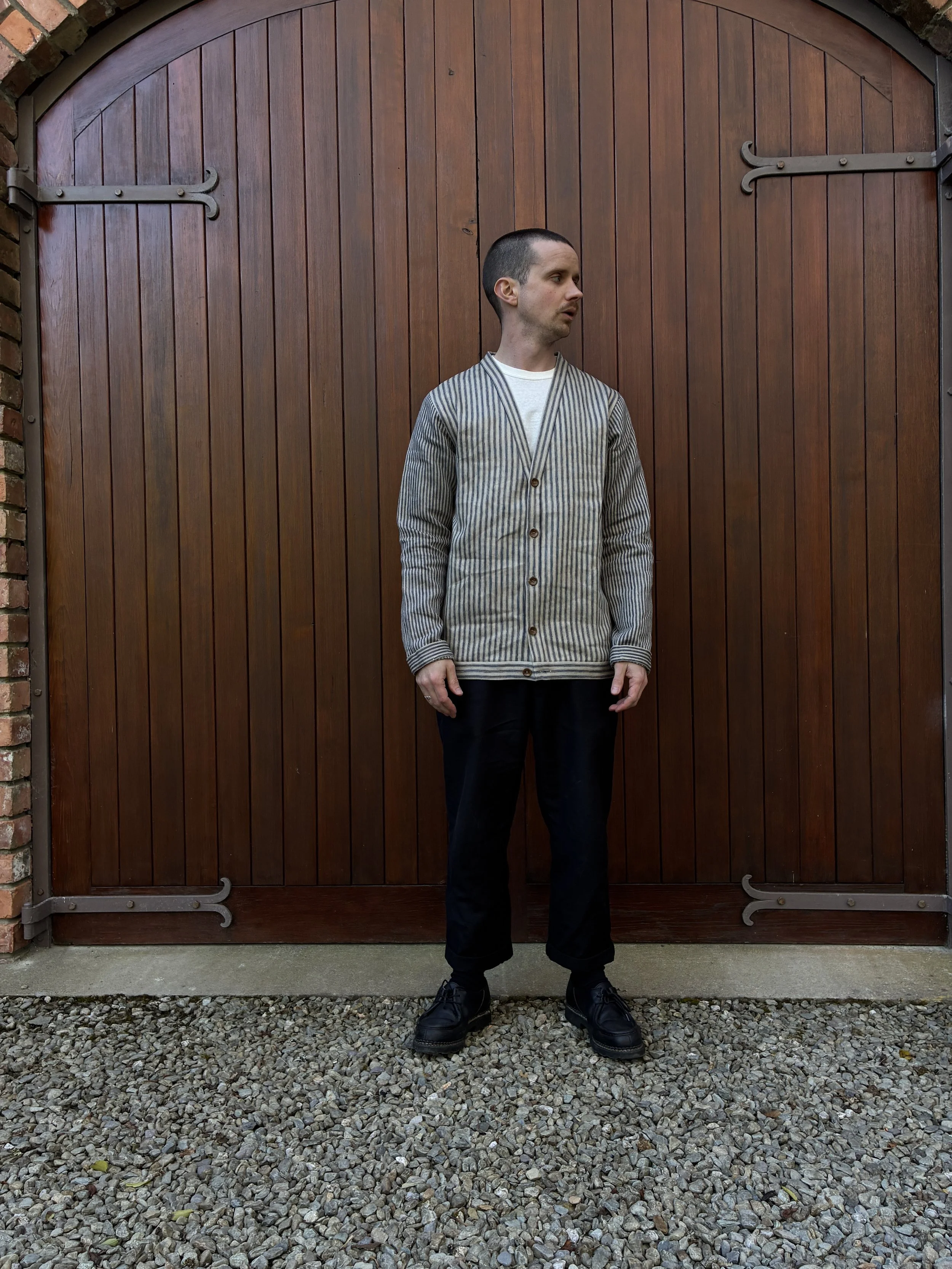 Man wearing Frank Leder Striped Linen Cardigan Jacket in front of door