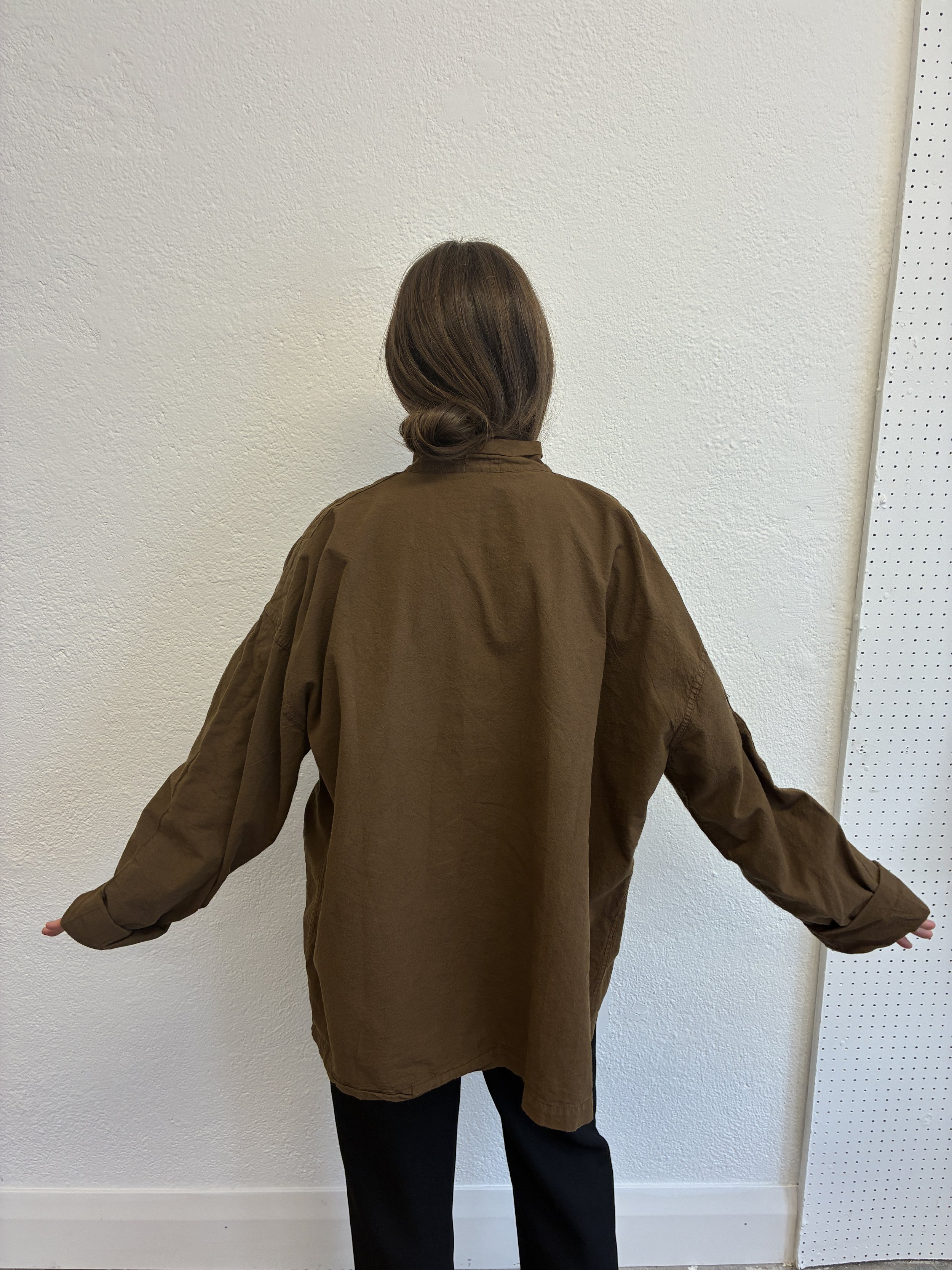 Back of woman wearing Tender Co Type 485 Isosceles Brown Hat Shirt