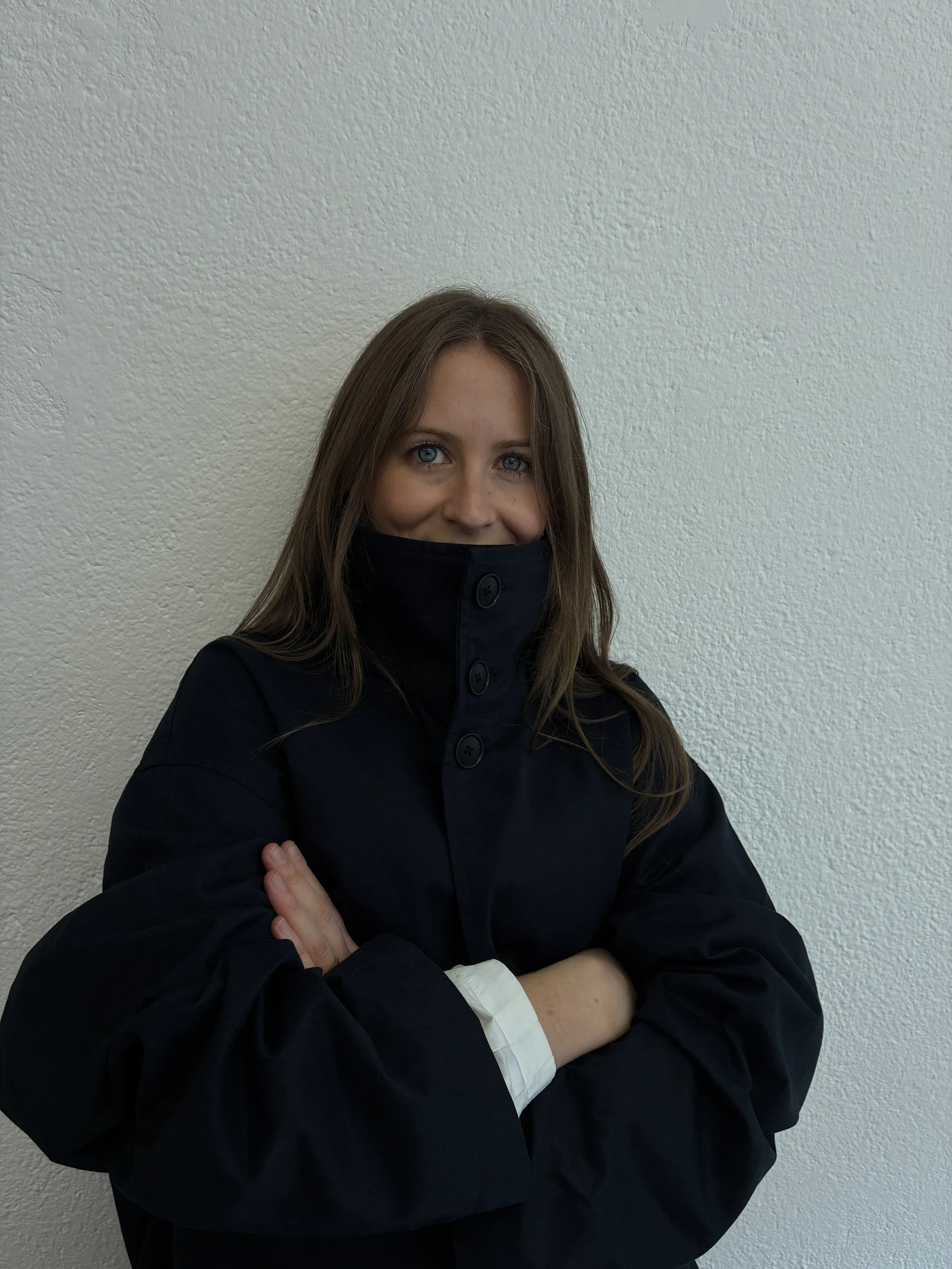 Closeup of woman wearing Navy De Dam Foundation Cotton Gabardine Trench Coat