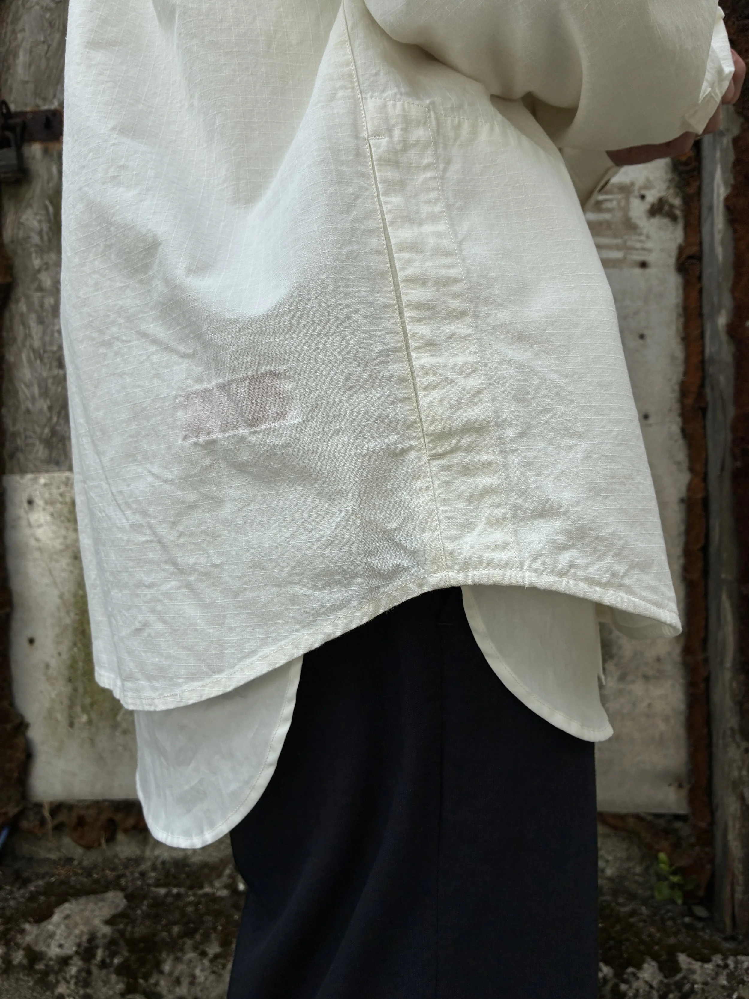 Hem of Man Off-White Ecru 1st PAT-RN Sumatra Overshirt worn on man