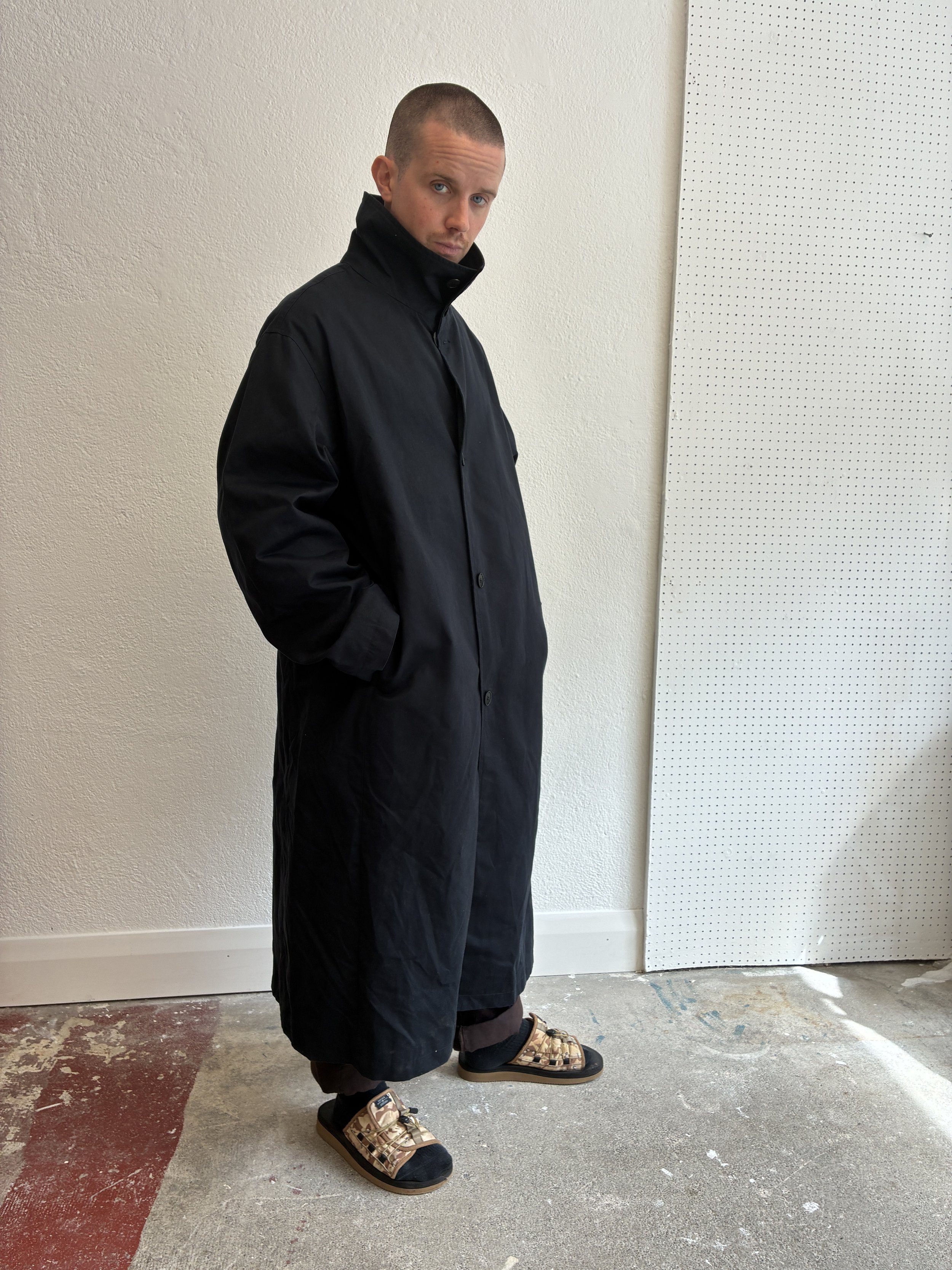 Man wearing Navy De Dam Foundation Cotton Gabardine Trench Coat