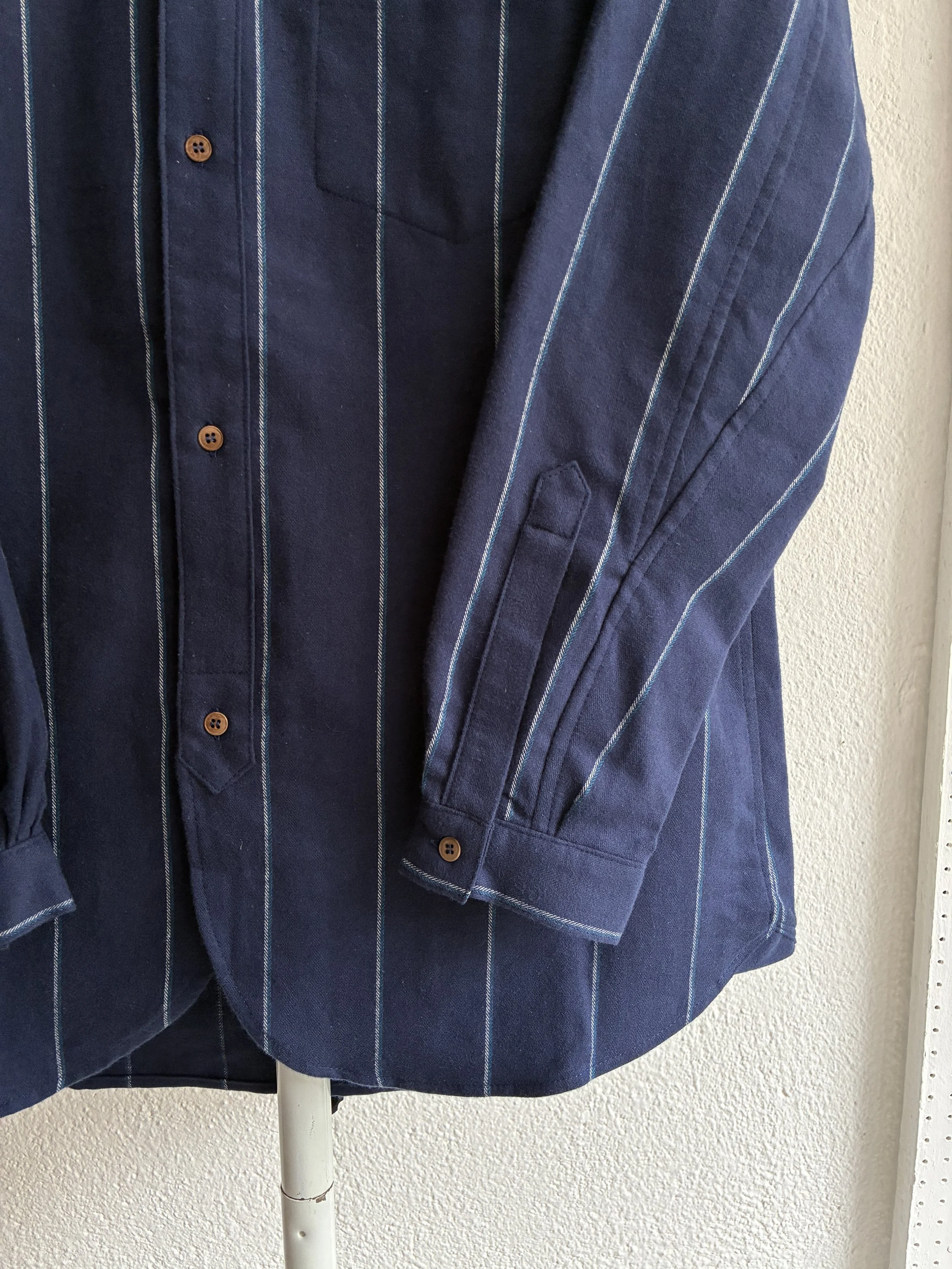 Closeup of cuffs of Frank Leder navy striped shirt