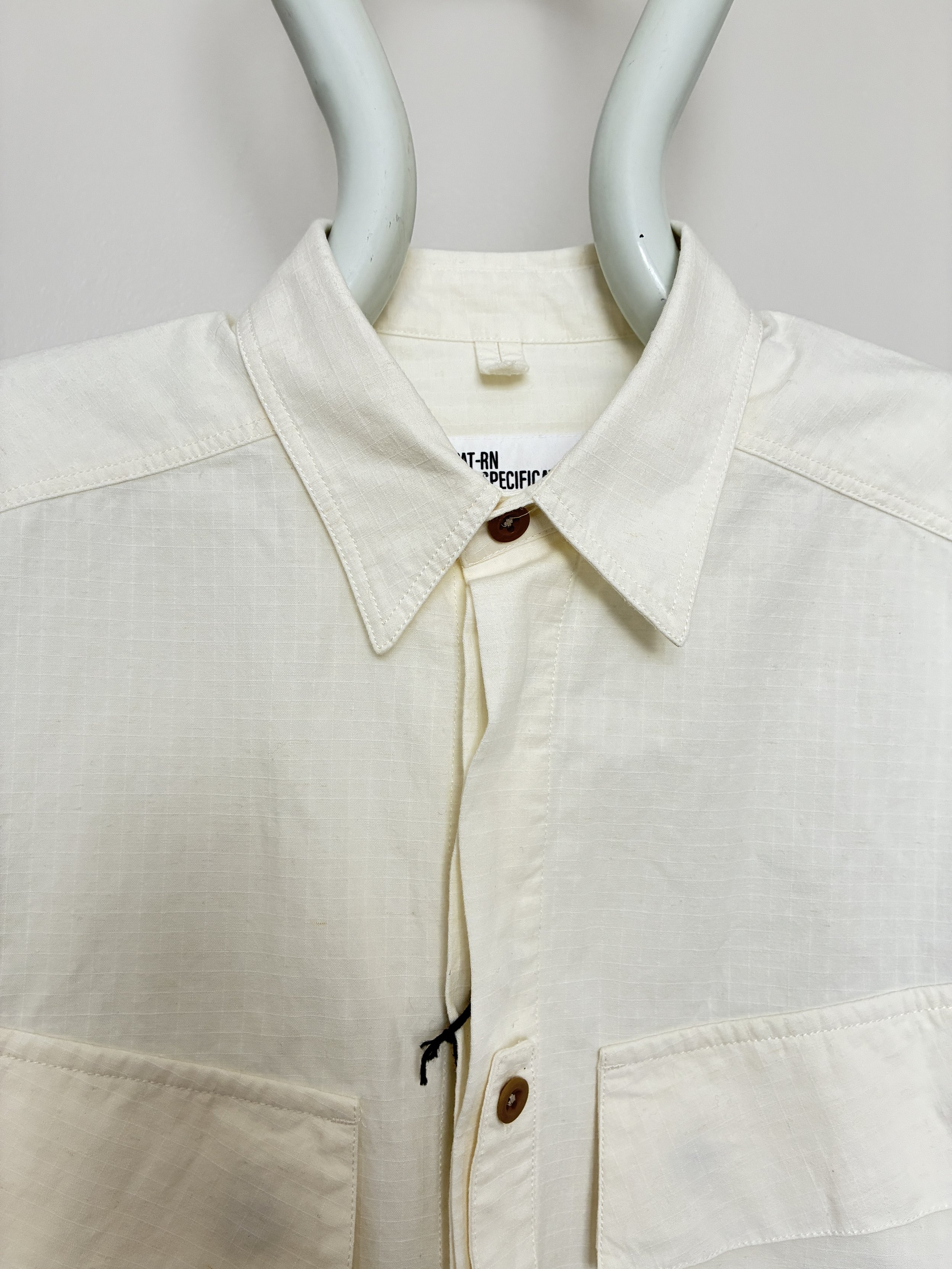 Closeup of collar of Off-White Ecru 1st PAT-RN Sumatra Overshirt on mannequin