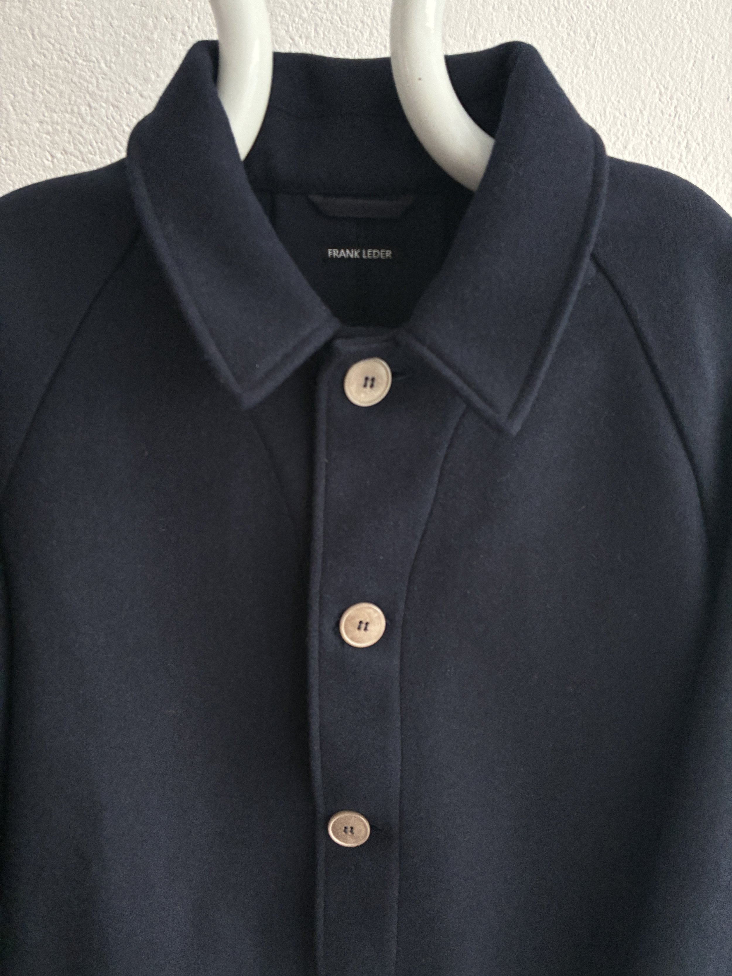 Mannequin wears Frank Leder Navy Wool Duster Coat, collar closeup view
