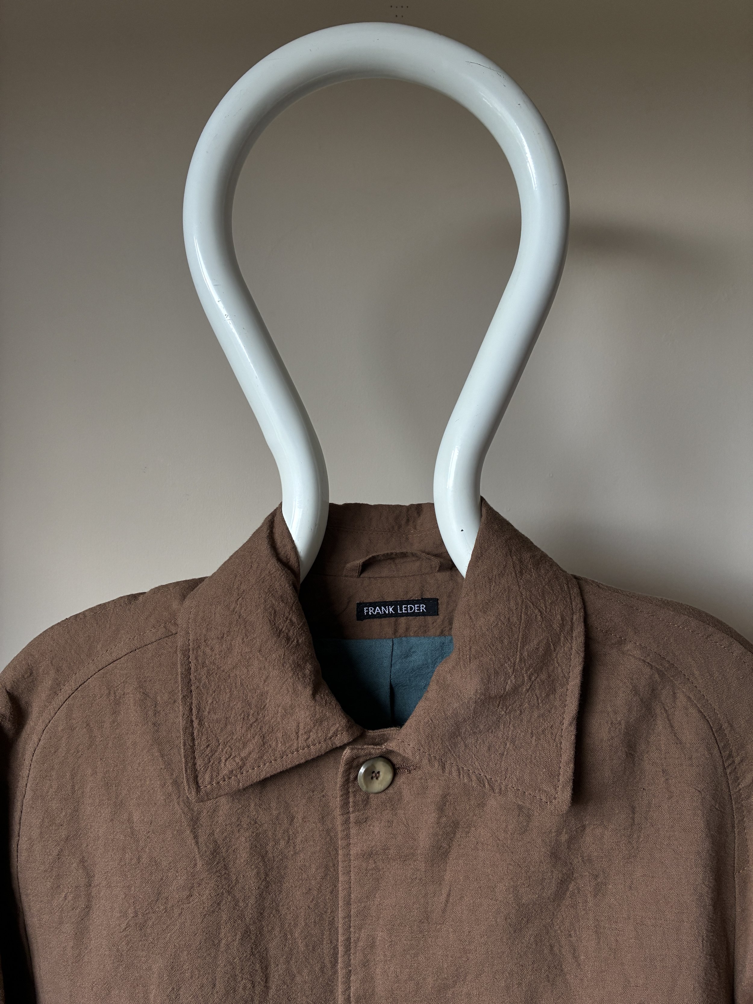 Close up of collar of Frank Leder Reversible Coat in Brown and Teal on mannequin