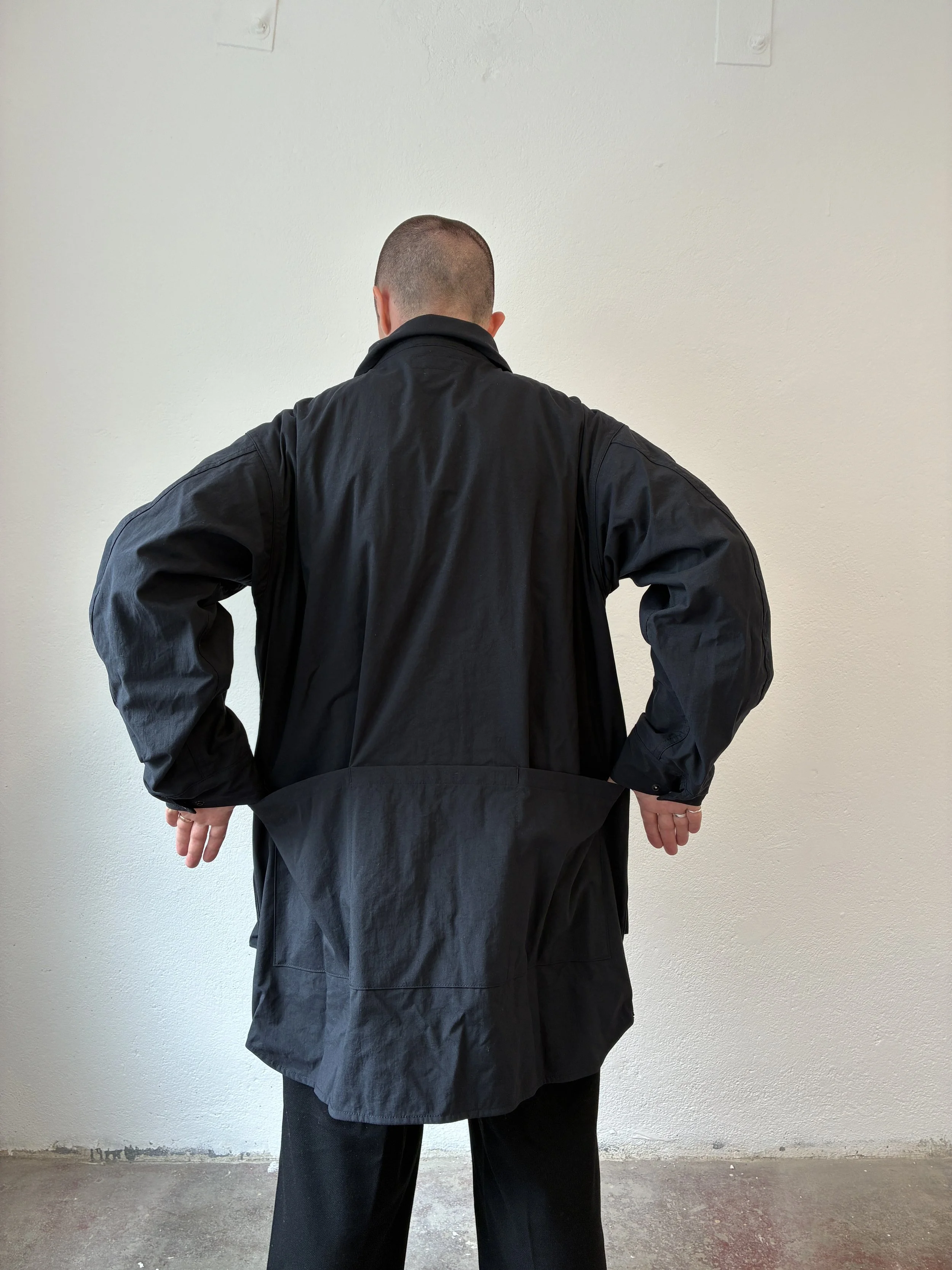 Back of Man wearing Black Sassafras Cultivator Coat