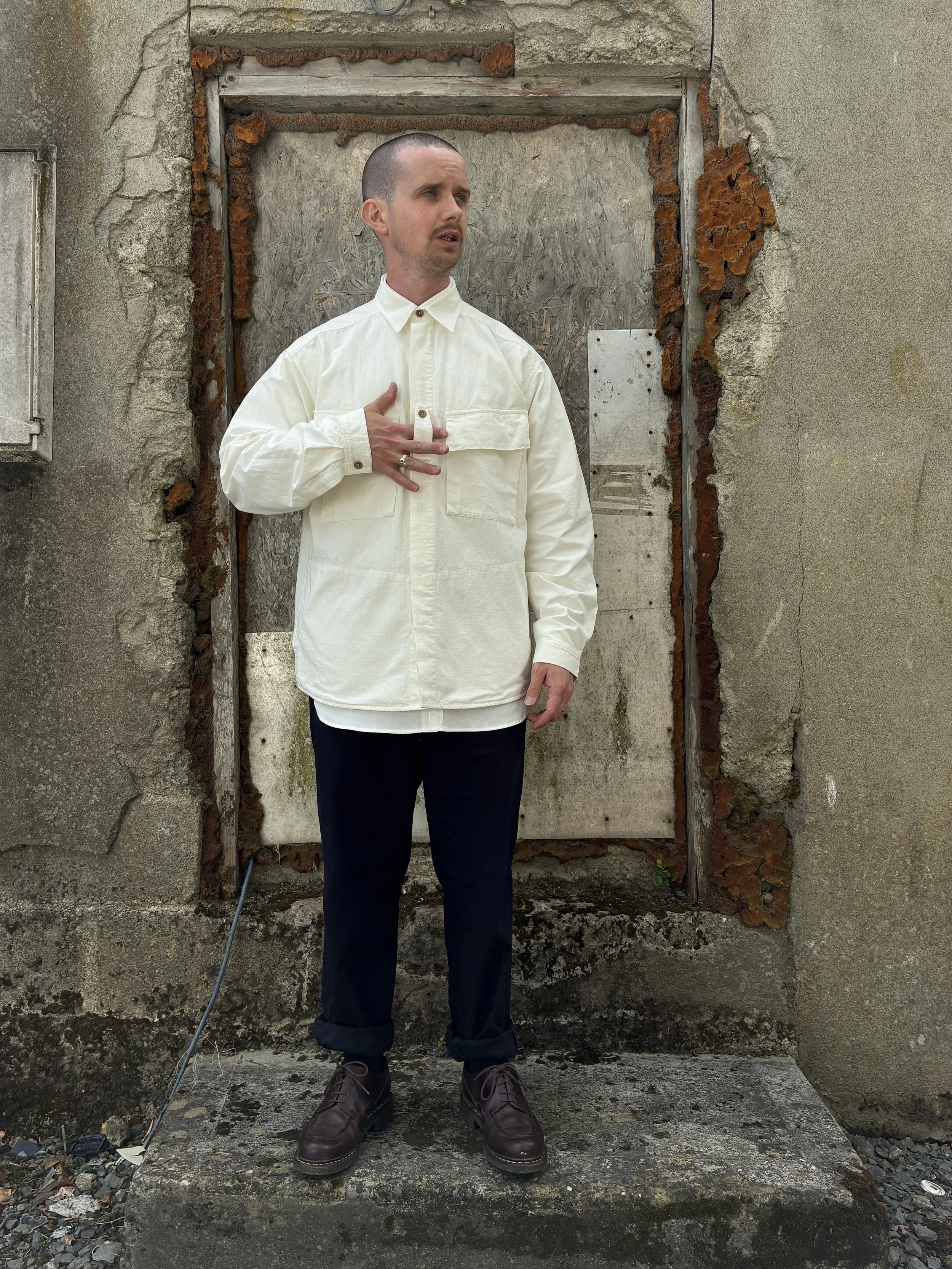 Man in front of wall wearing Off-White Ecru 1st PAT-RN Sumatra Overshirt
