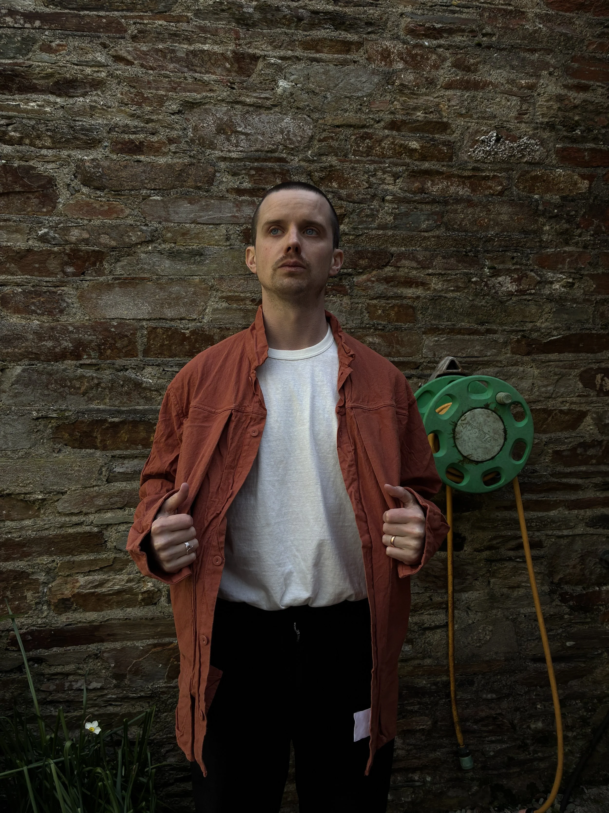 Man wearing unbuttoned Tender Co 402 Two Birds Shirt