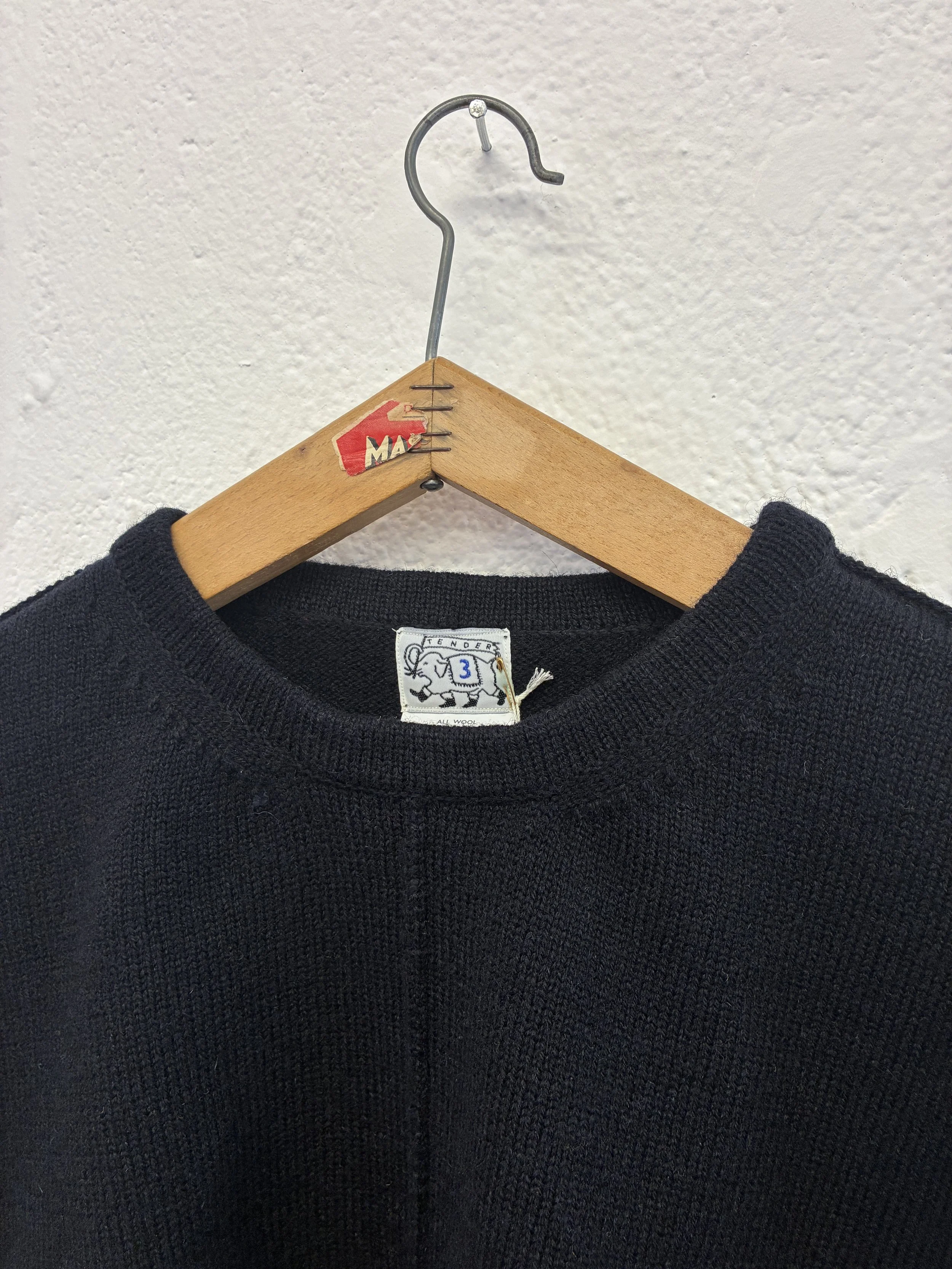 Closeup of collar of Navy Tender Co Type 719 Butterfly Jumper on hanger
