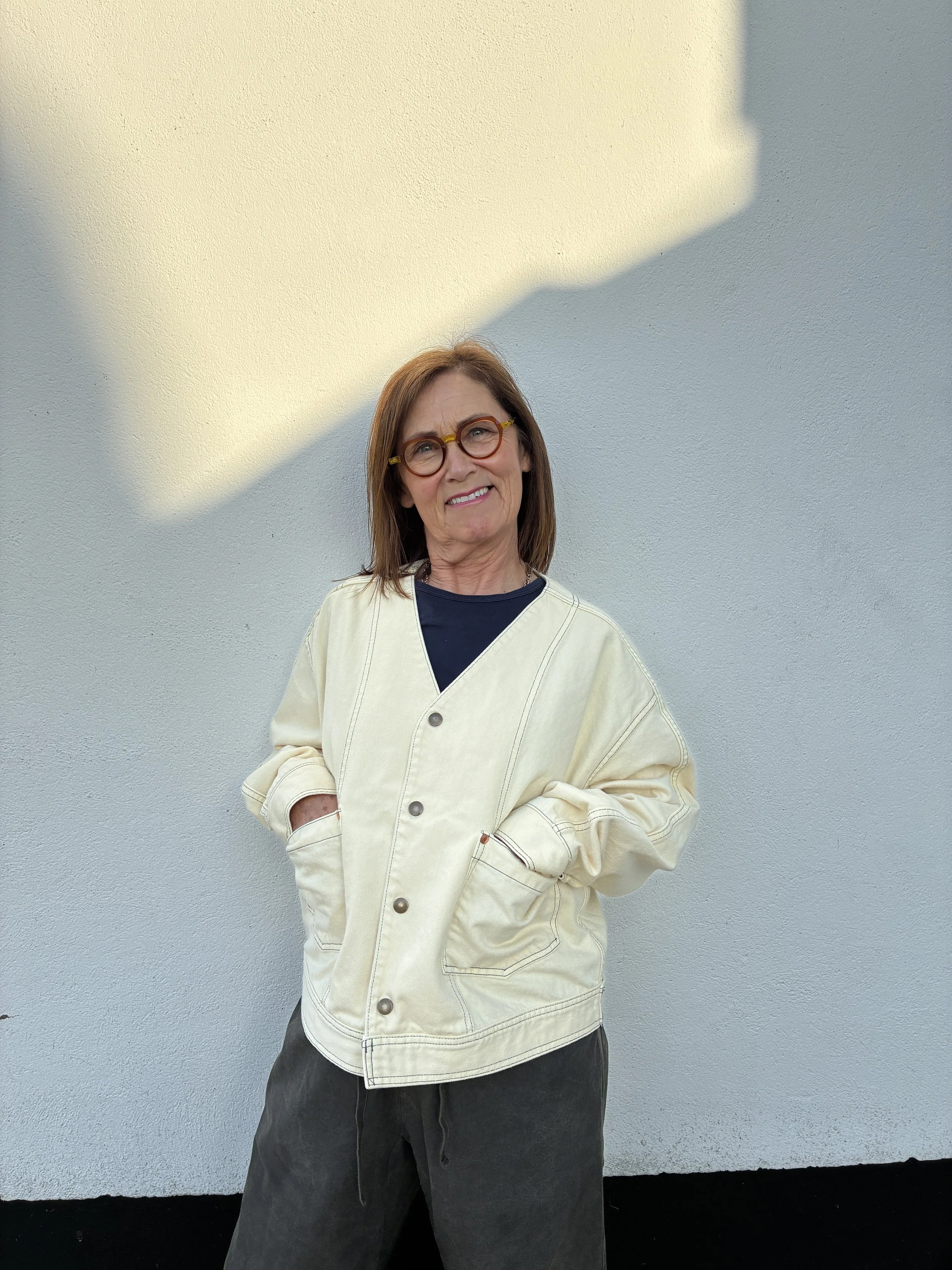Woman outside wearing Working Skewed yeast yellow jacket