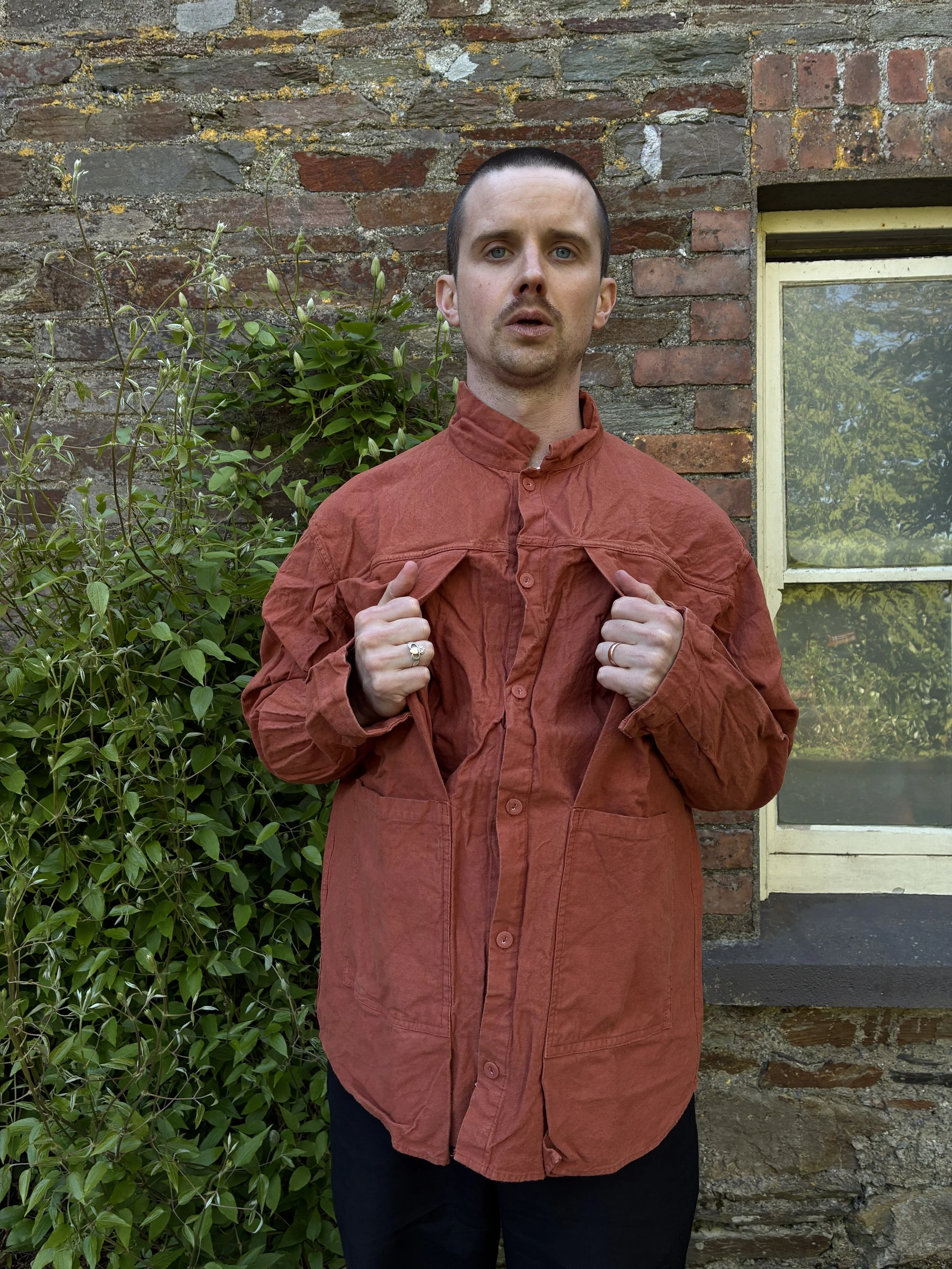 Man modelling orange Tender Co 402 Two Birds Shirt