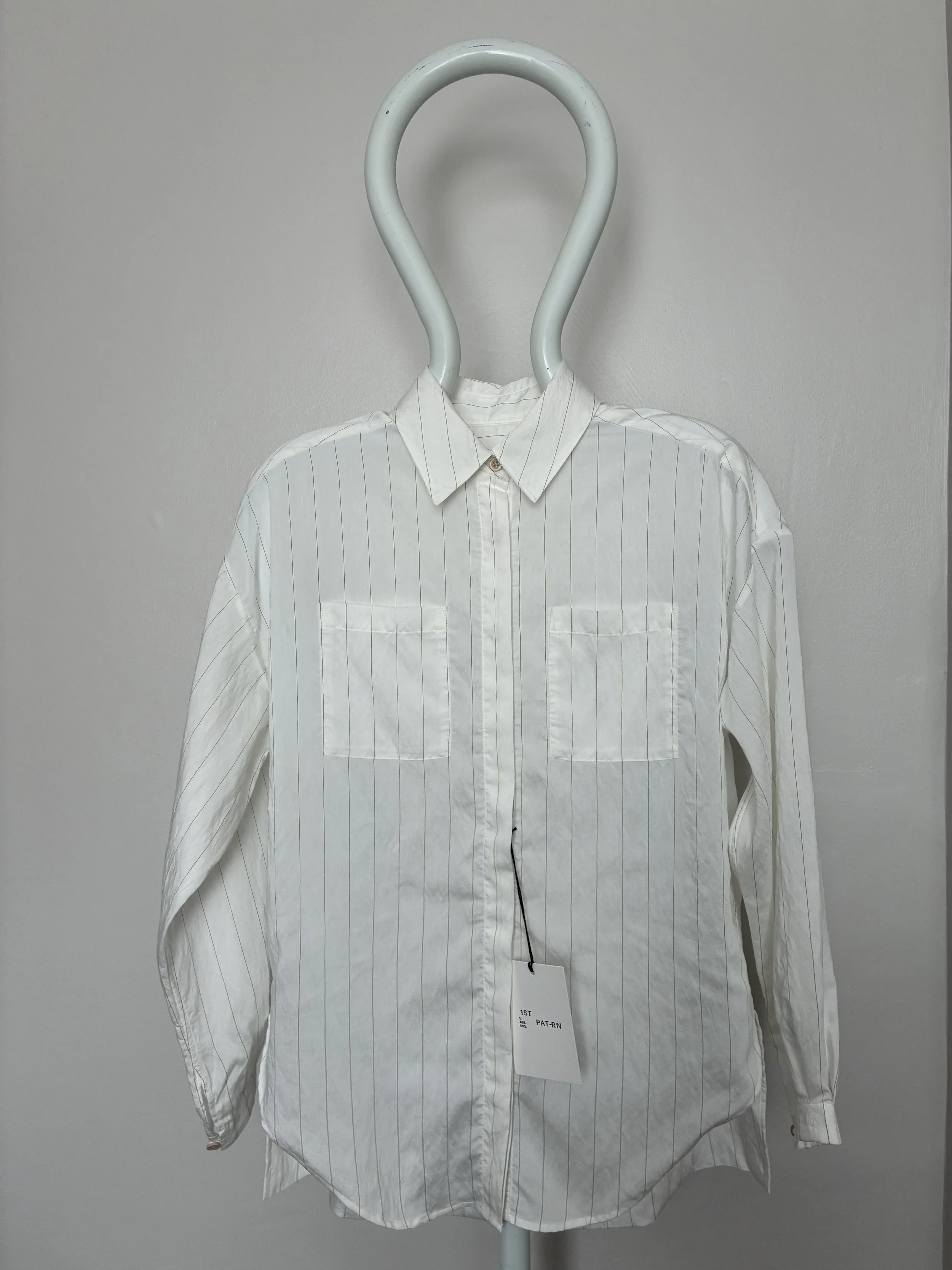 Mannequin wearing 1st PAT-RN Woman Modula Shirt in Tailored Stripes