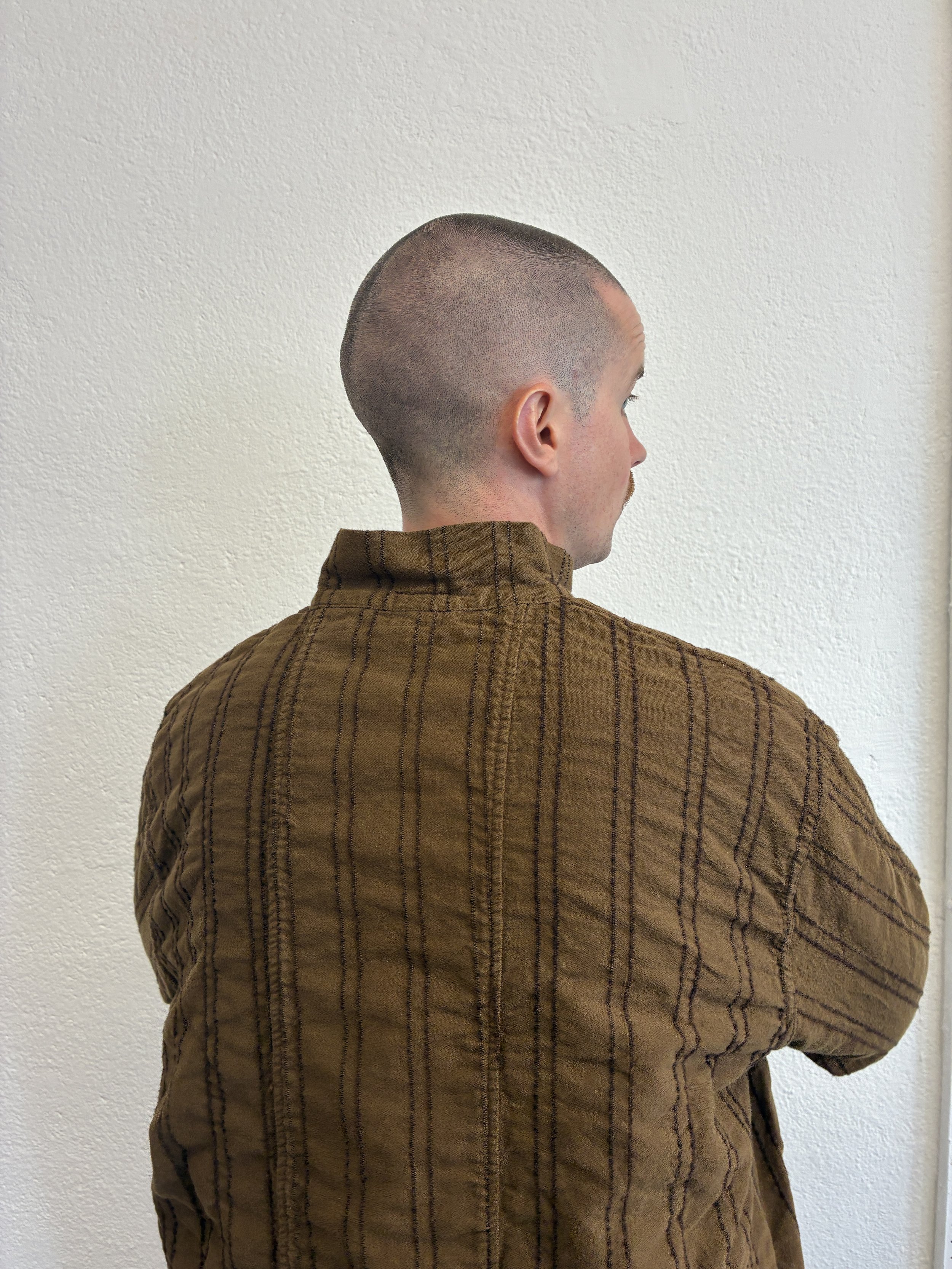 Closeup of back of man wearing Brown Tender Co Type 486 Burro Shirt
