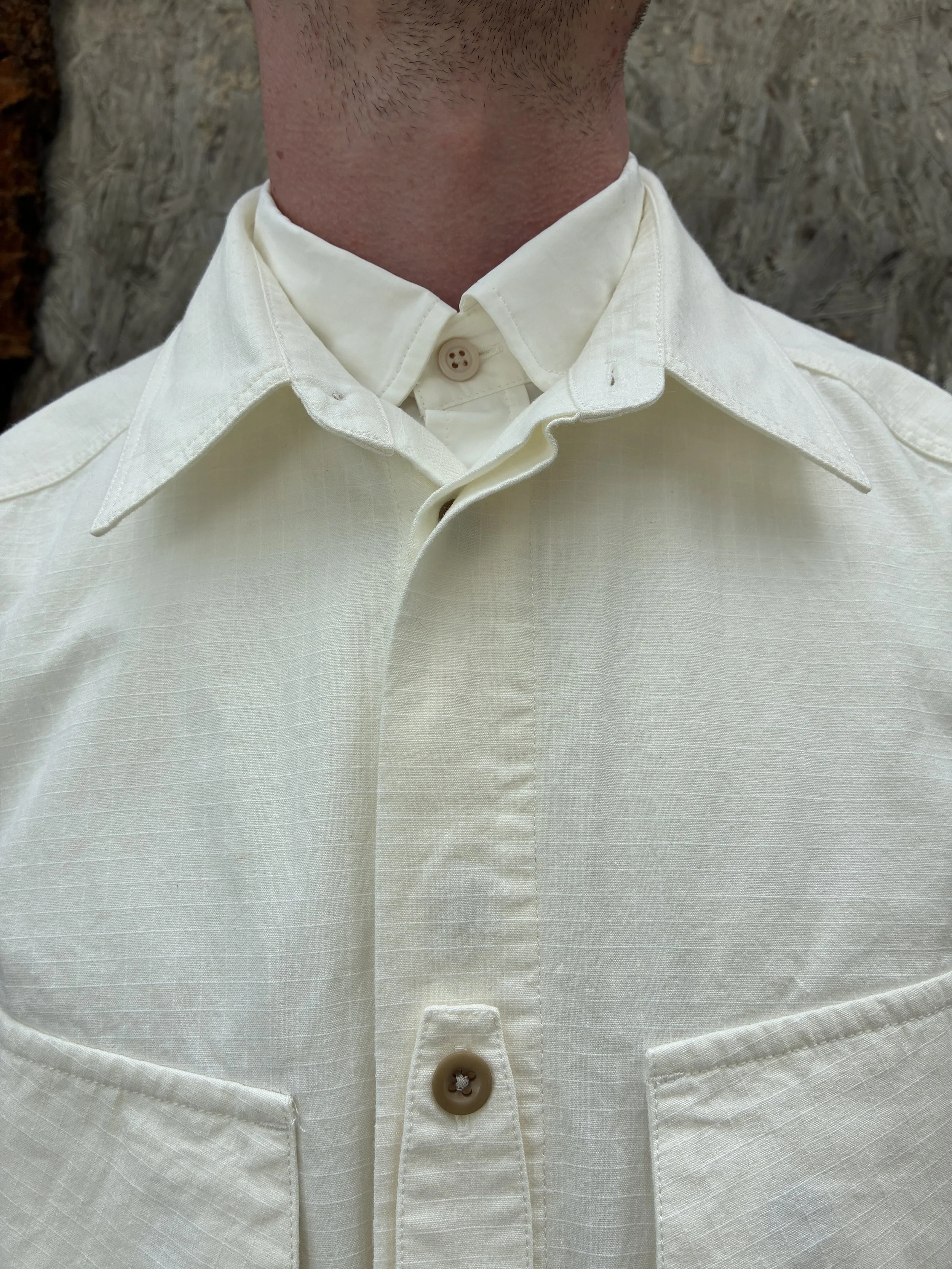 Closeup of collar of Off-White Ecru 1st PAT-RN Sumatra Overshirt worn on man